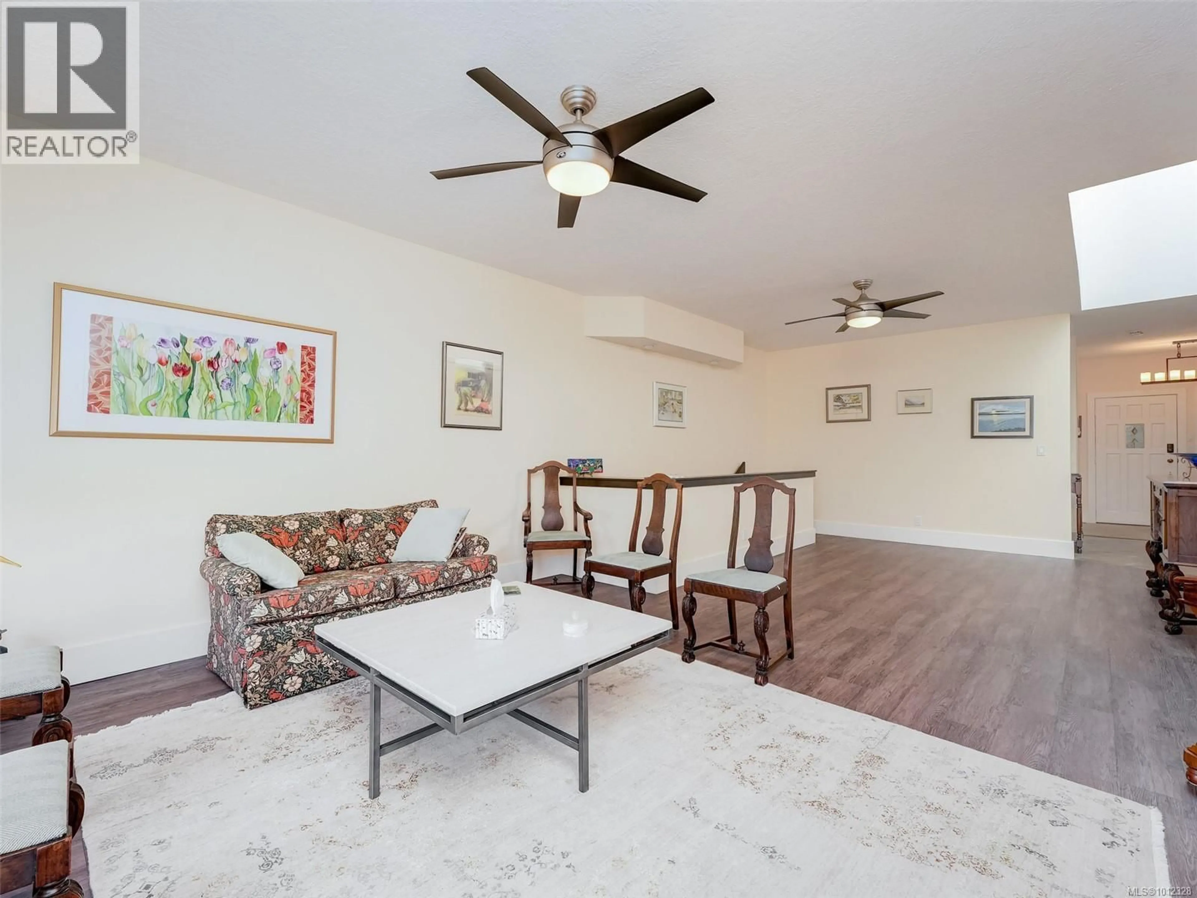 Living room with furniture, wood/laminate floor for 44 - 4318 EMILY CARR DRIVE, Saanich British Columbia V8X5E7