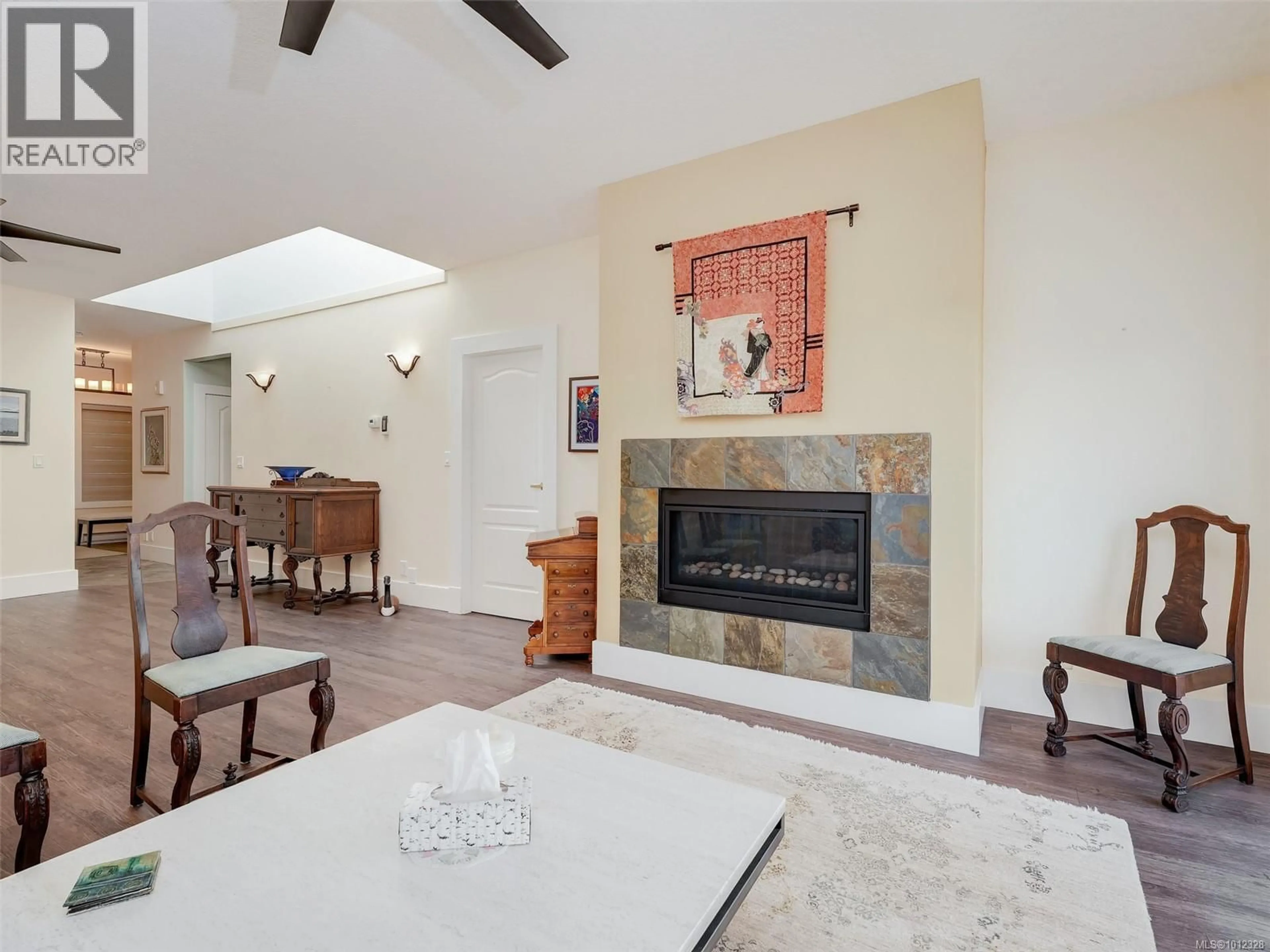 Living room with furniture, ceramic/tile floor for 44 - 4318 EMILY CARR DRIVE, Saanich British Columbia V8X5E7