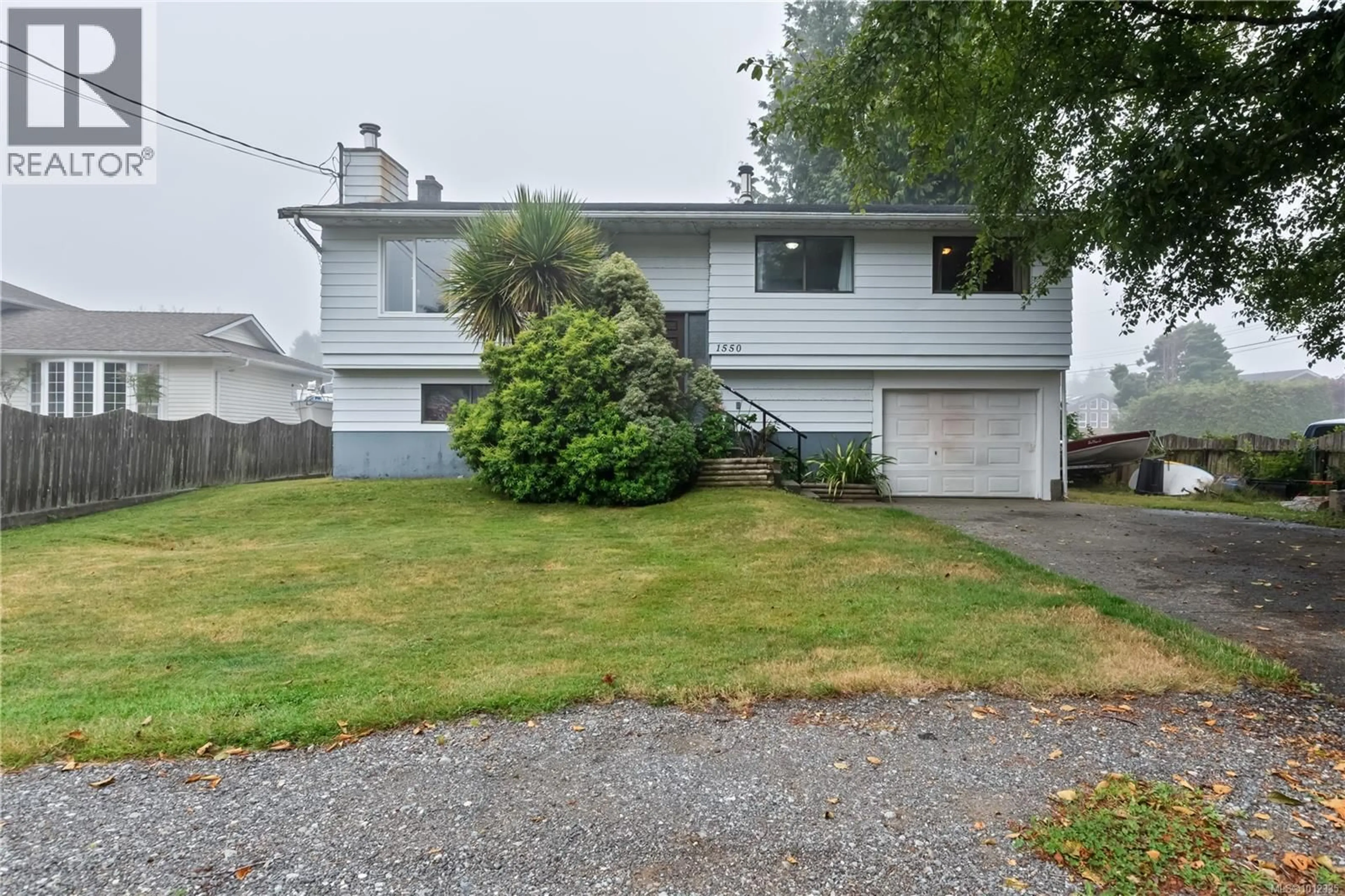 Home with vinyl exterior material, street for 1550 LARCH ROAD, Ucluelet British Columbia V0R3A0