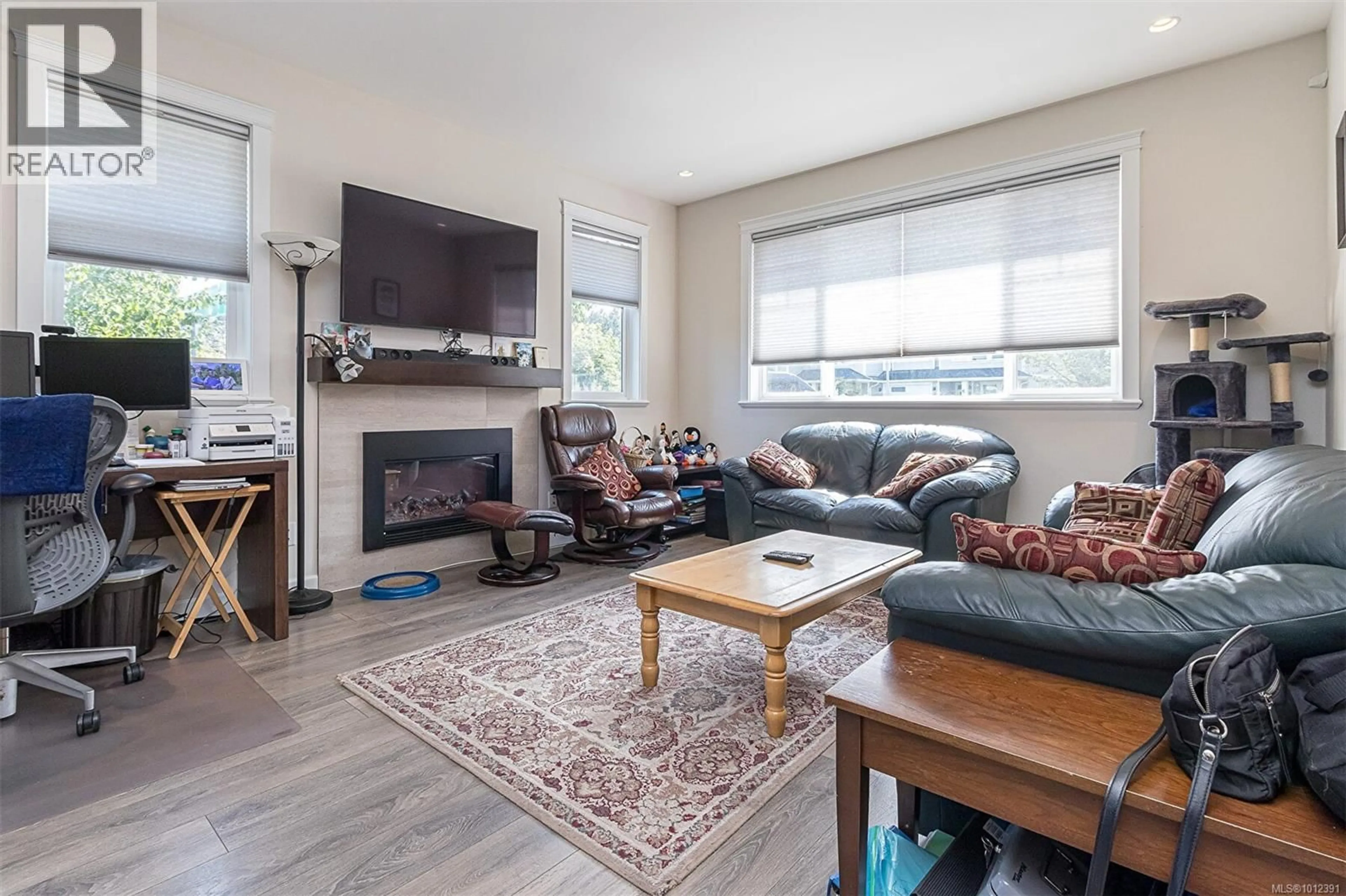 Living room with furniture, wood/laminate floor for 2403 BELLAMY ROAD, Langford British Columbia V9B0R8