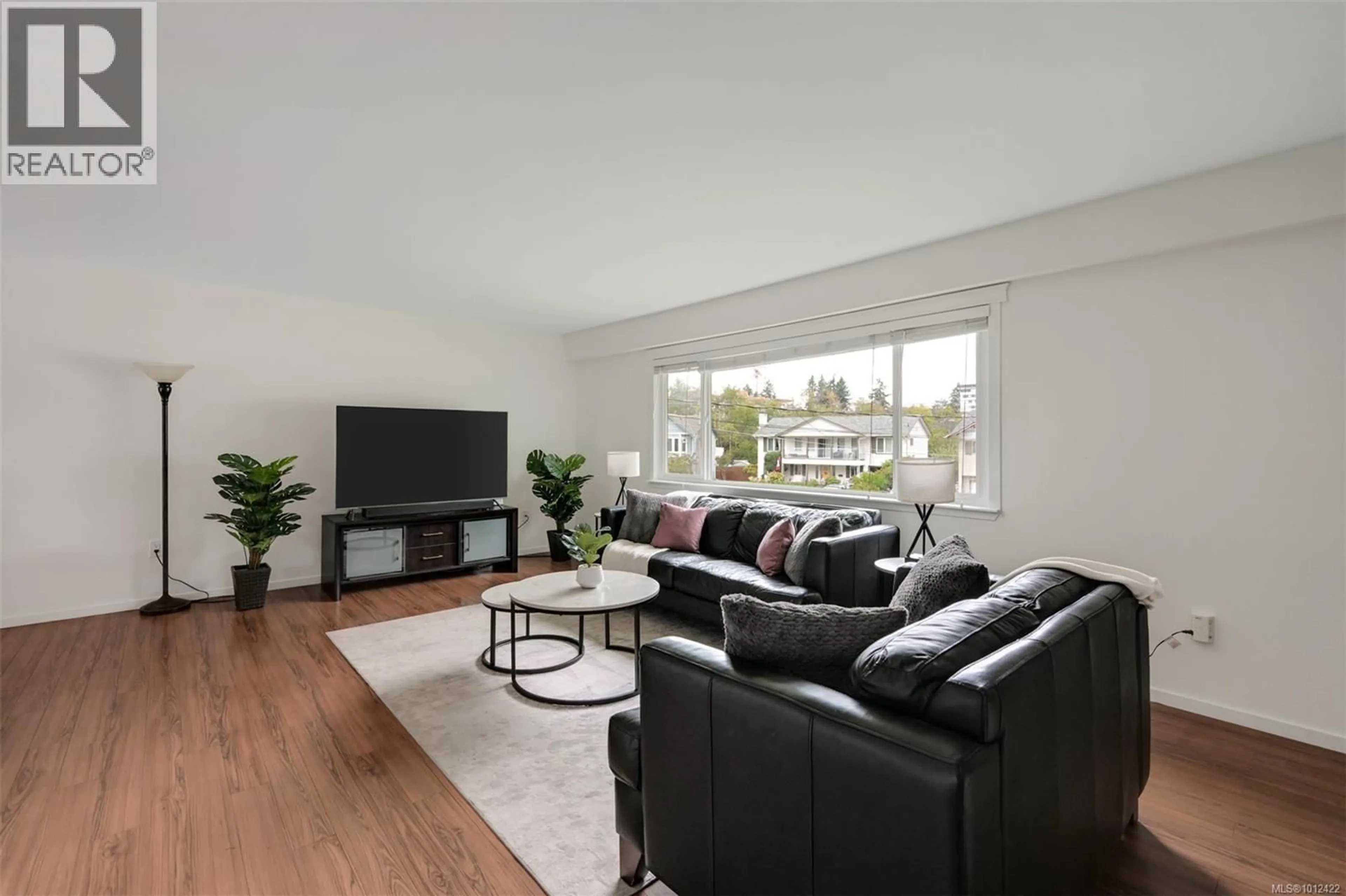 Living room with furniture, wood/laminate floor for 2874 PICKFORD ROAD, Colwood British Columbia V9B4N2