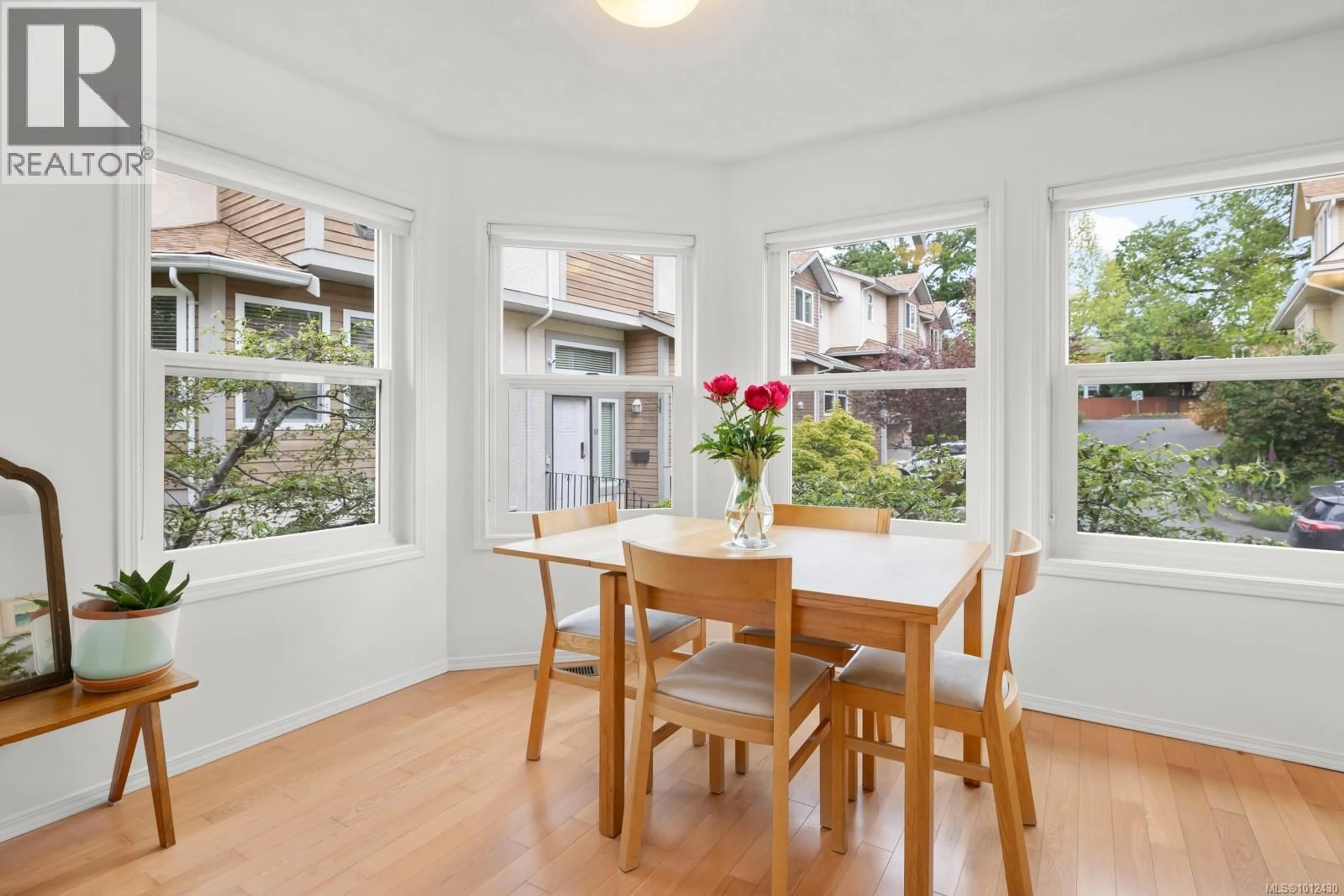 Dining room, wood/laminate floor for 10 - 4580 WEST SAANICH ROAD, Saanich British Columbia V8Z3G4