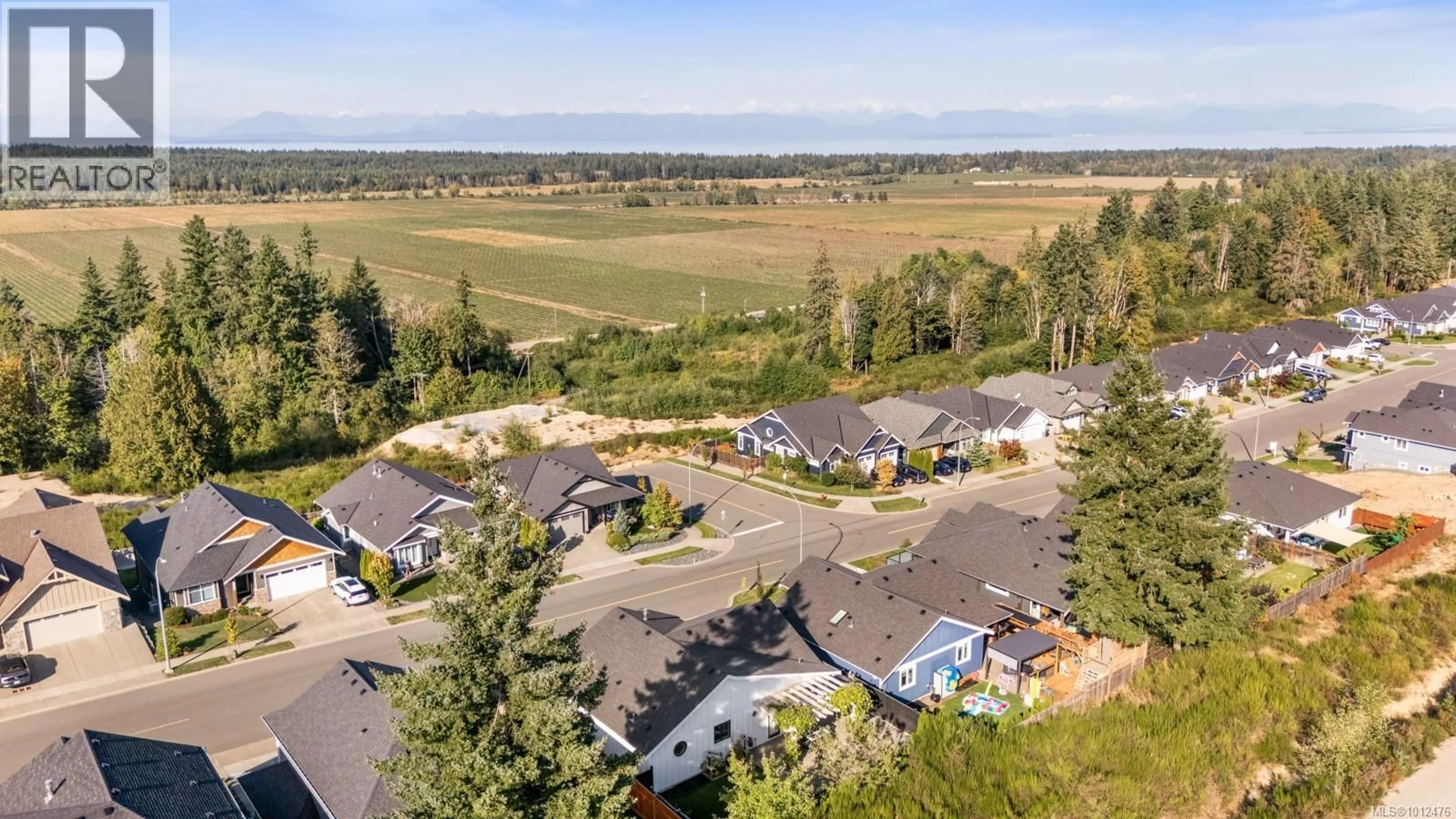 A pic from outside/outdoor area/front of a property/back of a property/a pic from drone, mountain view for 1371 CROWN ISLE BOULEVARD, Courtenay British Columbia V9N0E2