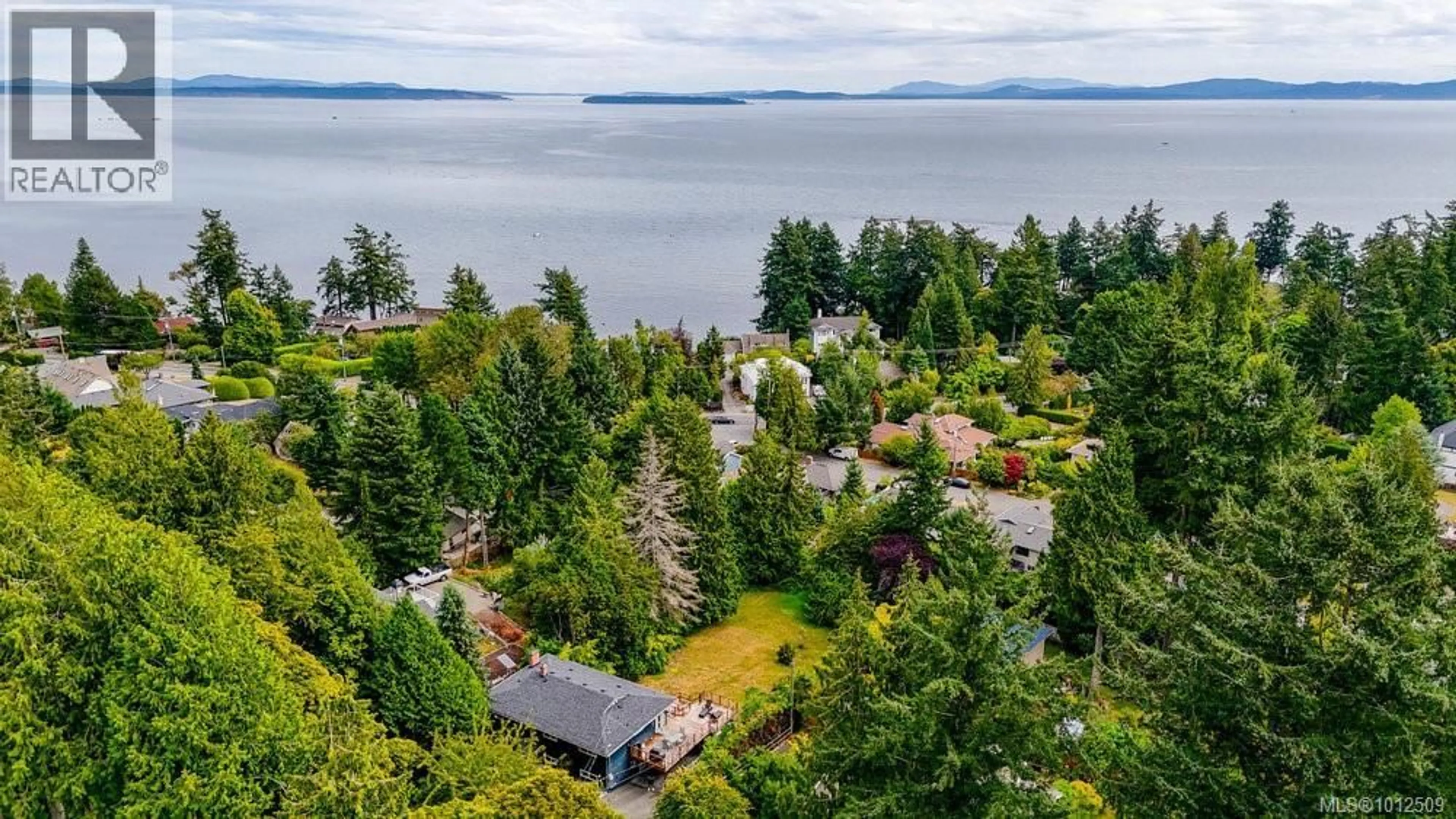 A pic from outside/outdoor area/front of a property/back of a property/a pic from drone, water/lake/river/ocean view for 4905 LOCHSIDE DRIVE, Saanich British Columbia V8Y2E6