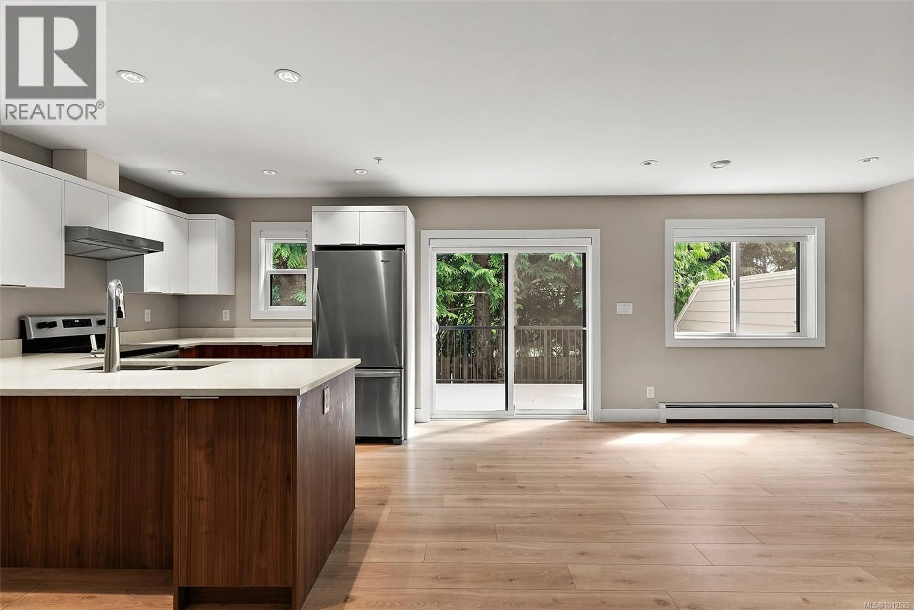 Open concept kitchen, wood/laminate floor for 104 - 2096 KENNEDY STREET, Sooke British Columbia V9Z0Z1