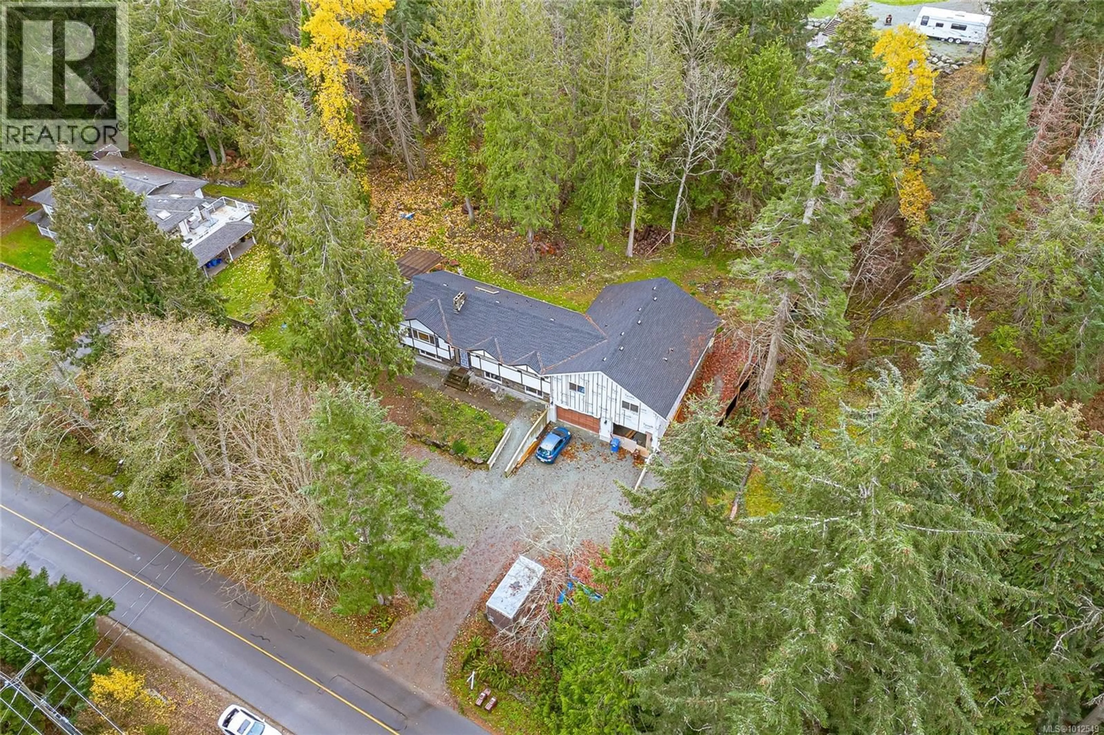 A pic from outside/outdoor area/front of a property/back of a property/a pic from drone, forest/trees view for 1077 LANDS END ROAD, North Saanich British Columbia V8L5L3
