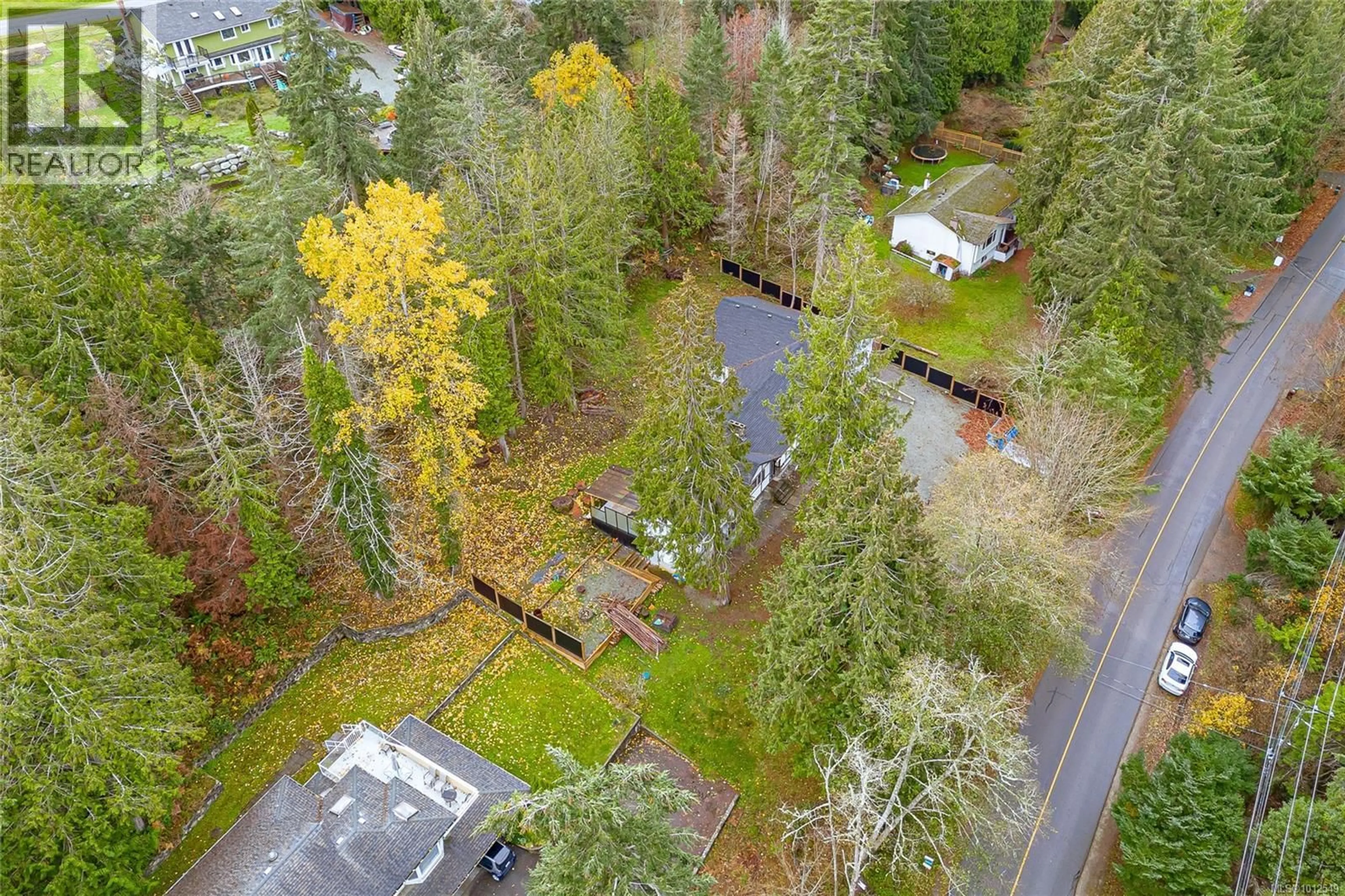A pic from outside/outdoor area/front of a property/back of a property/a pic from drone, forest/trees view for 1077 LANDS END ROAD, North Saanich British Columbia V8L5L3