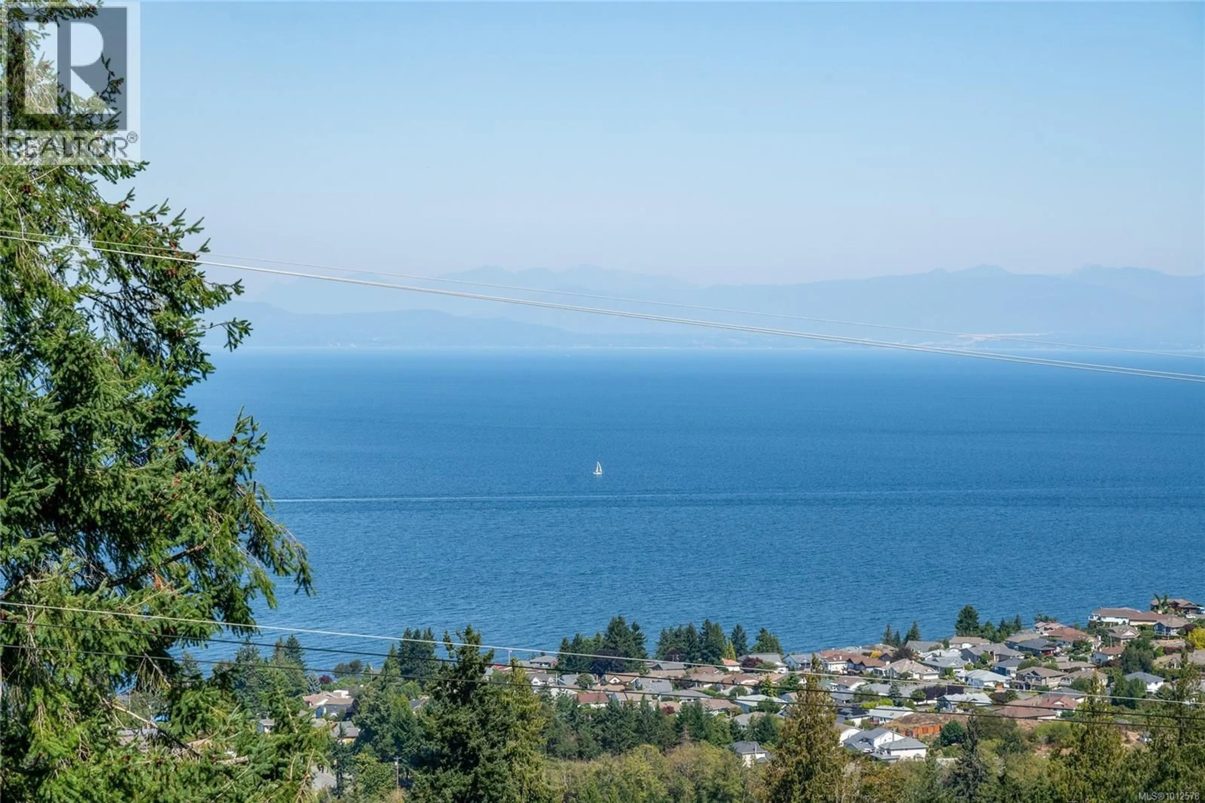 A pic from outside/outdoor area/front of a property/back of a property/a pic from drone, water/lake/river/ocean view for 5267 LOST LAKE ROAD, Nanaimo British Columbia V9T5E6