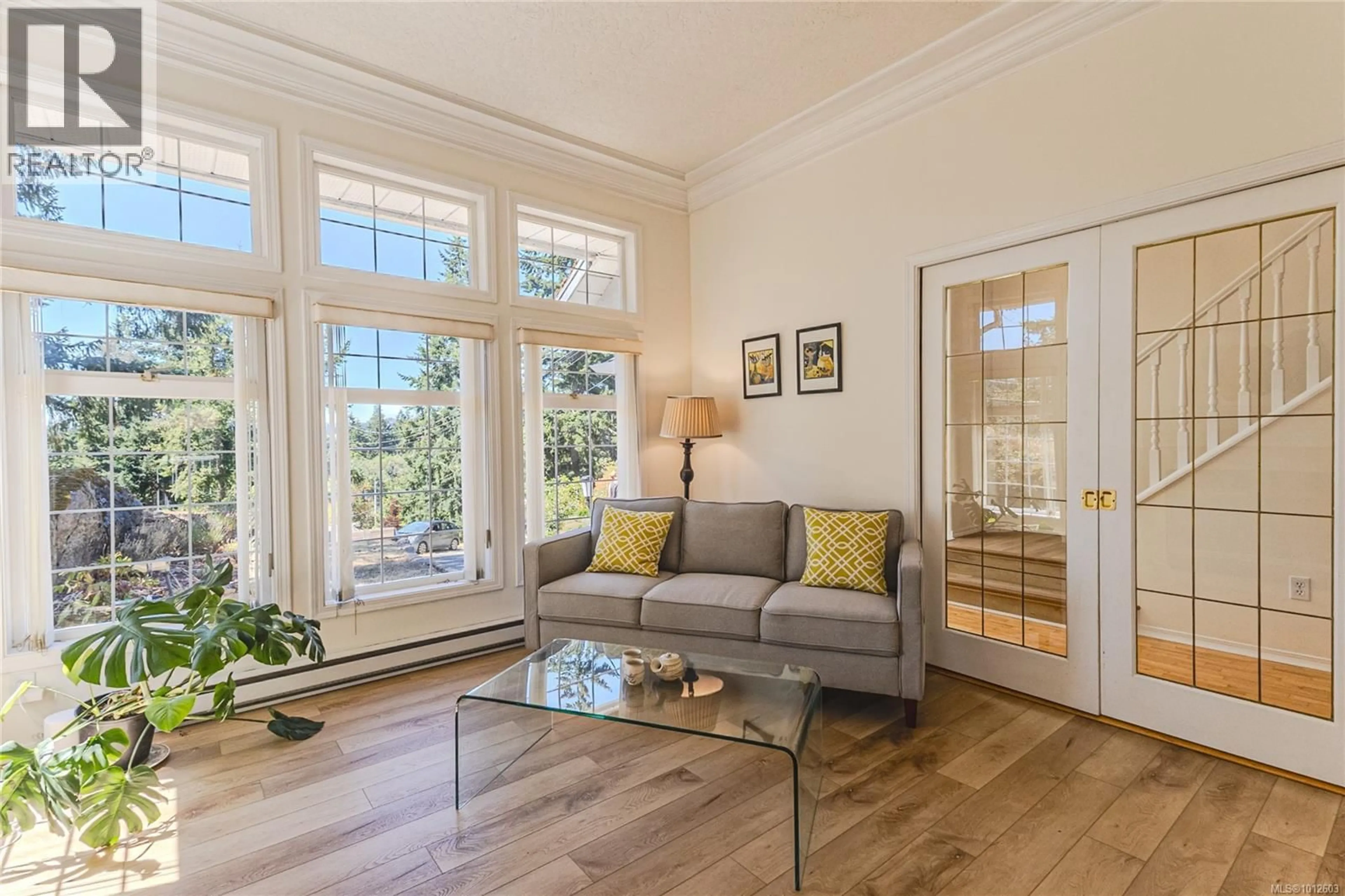 Living room with furniture, wood/laminate floor for 407 CORALEE PLACE, Langford British Columbia V9B6C4