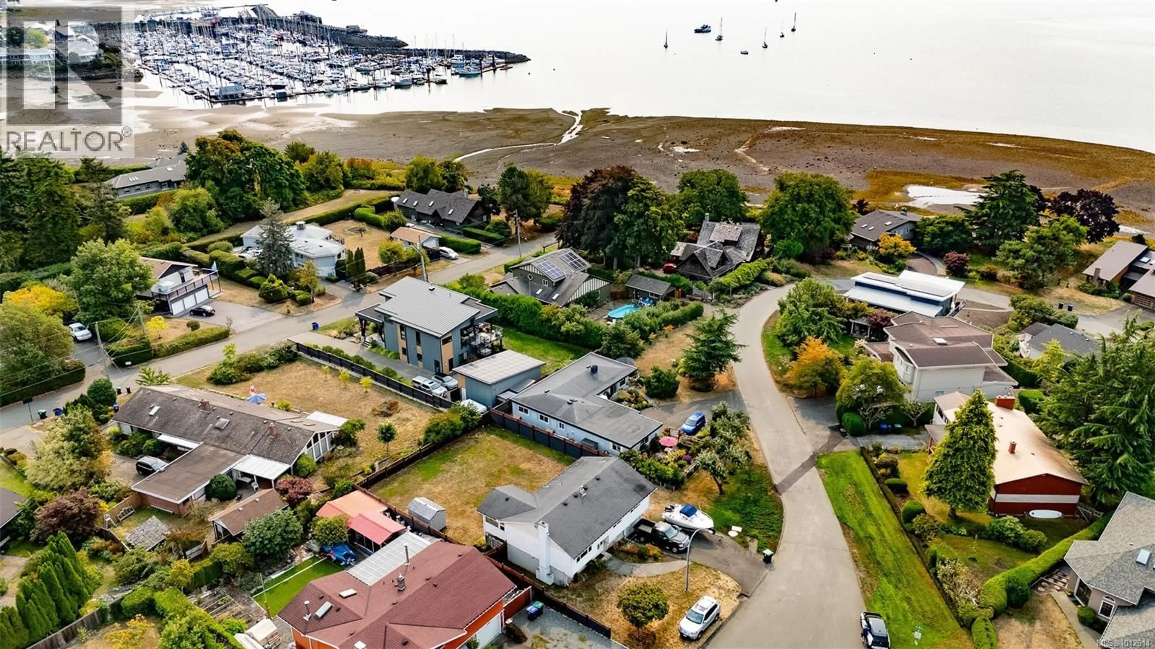 A pic from outside/outdoor area/front of a property/back of a property/a pic from drone, water/lake/river/ocean view for 140 BEACH DRIVE, Comox British Columbia V9M1T6