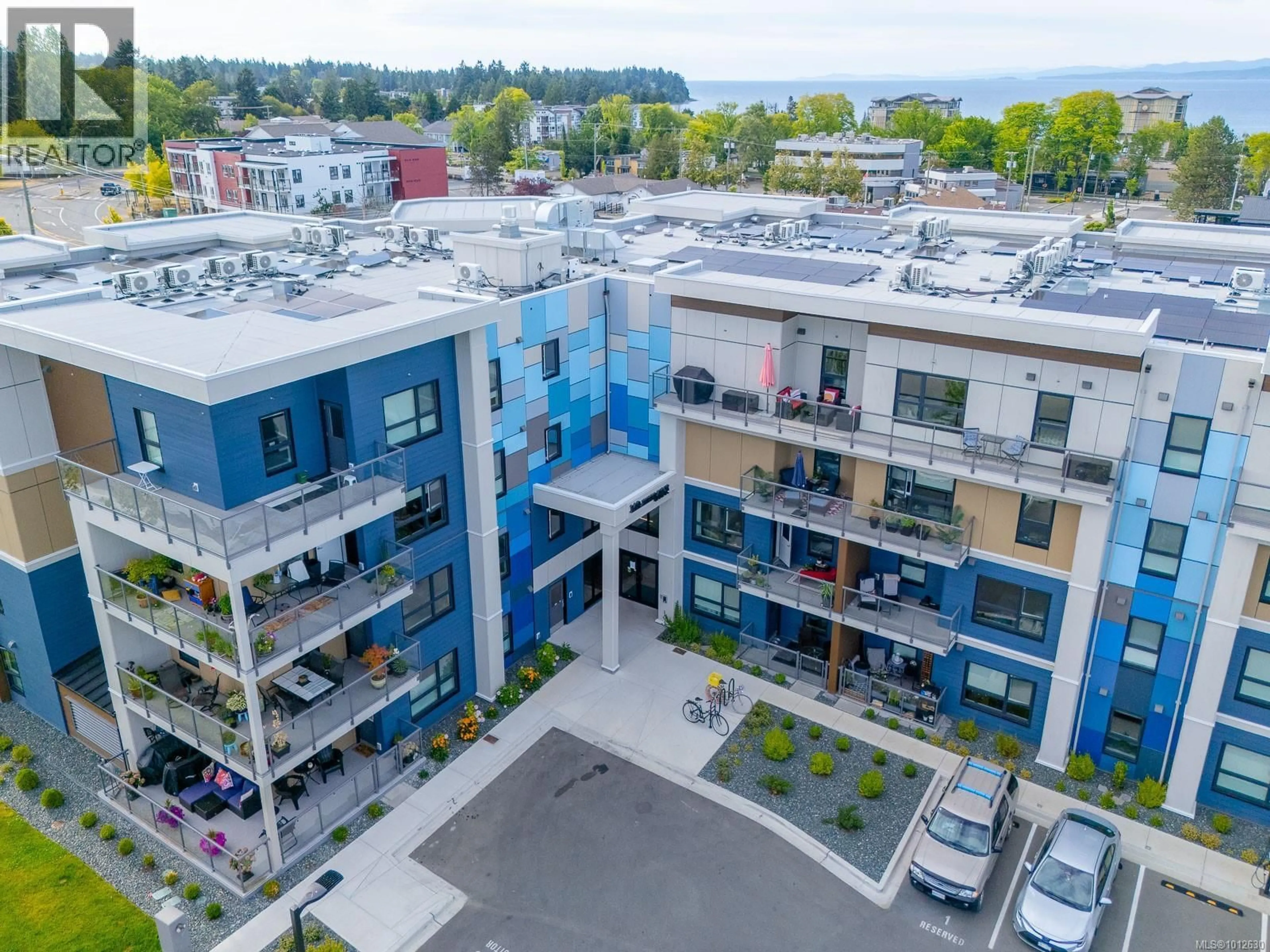 A pic from outside/outdoor area/front of a property/back of a property/a pic from drone, city buildings view from balcony for 406 - 140 JENSEN AVENUE WEST, Parksville British Columbia V9P0H7