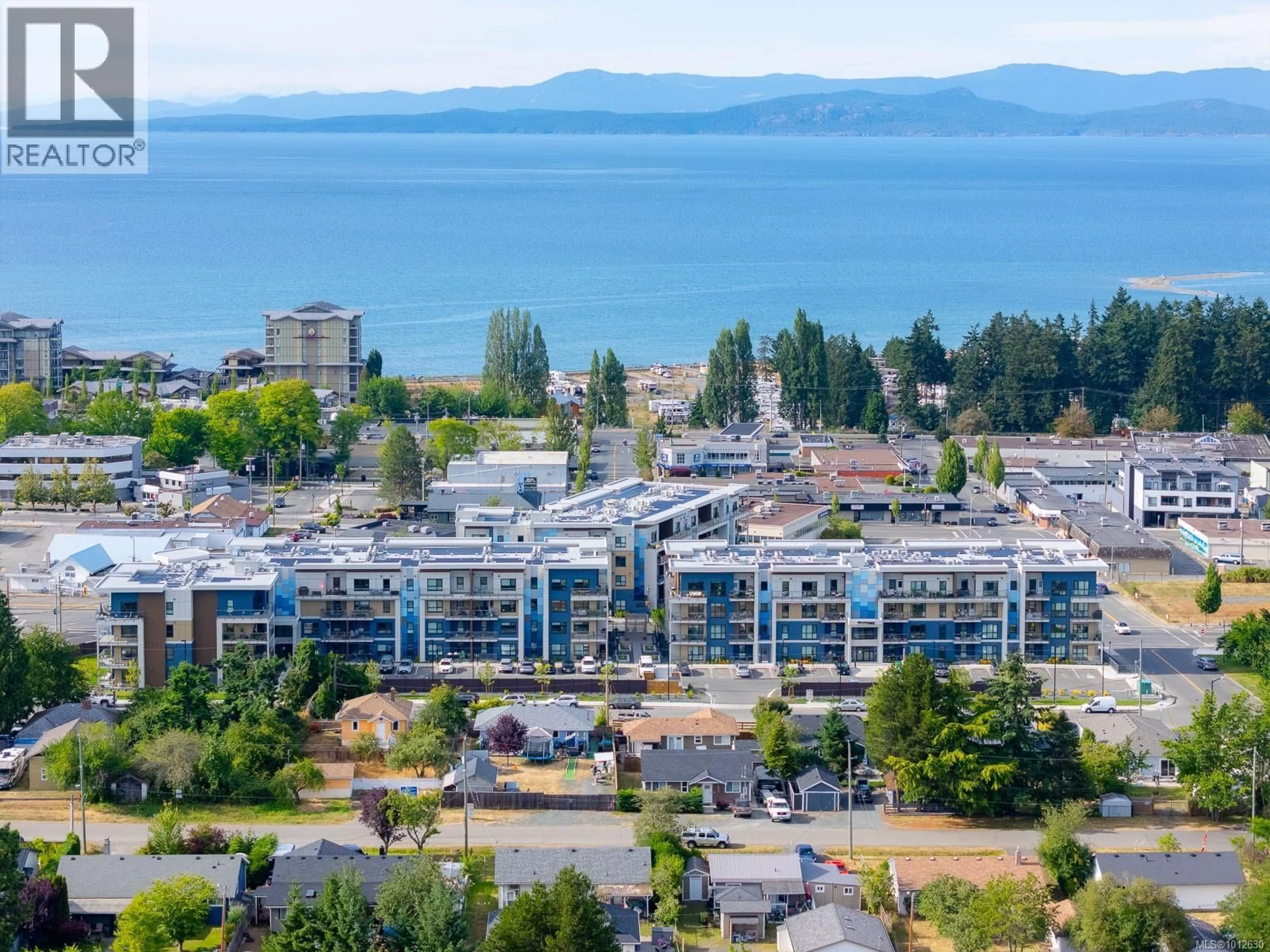 A pic from outside/outdoor area/front of a property/back of a property/a pic from drone, water/lake/river/ocean view for 406 - 140 JENSEN AVENUE WEST, Parksville British Columbia V9P0H7