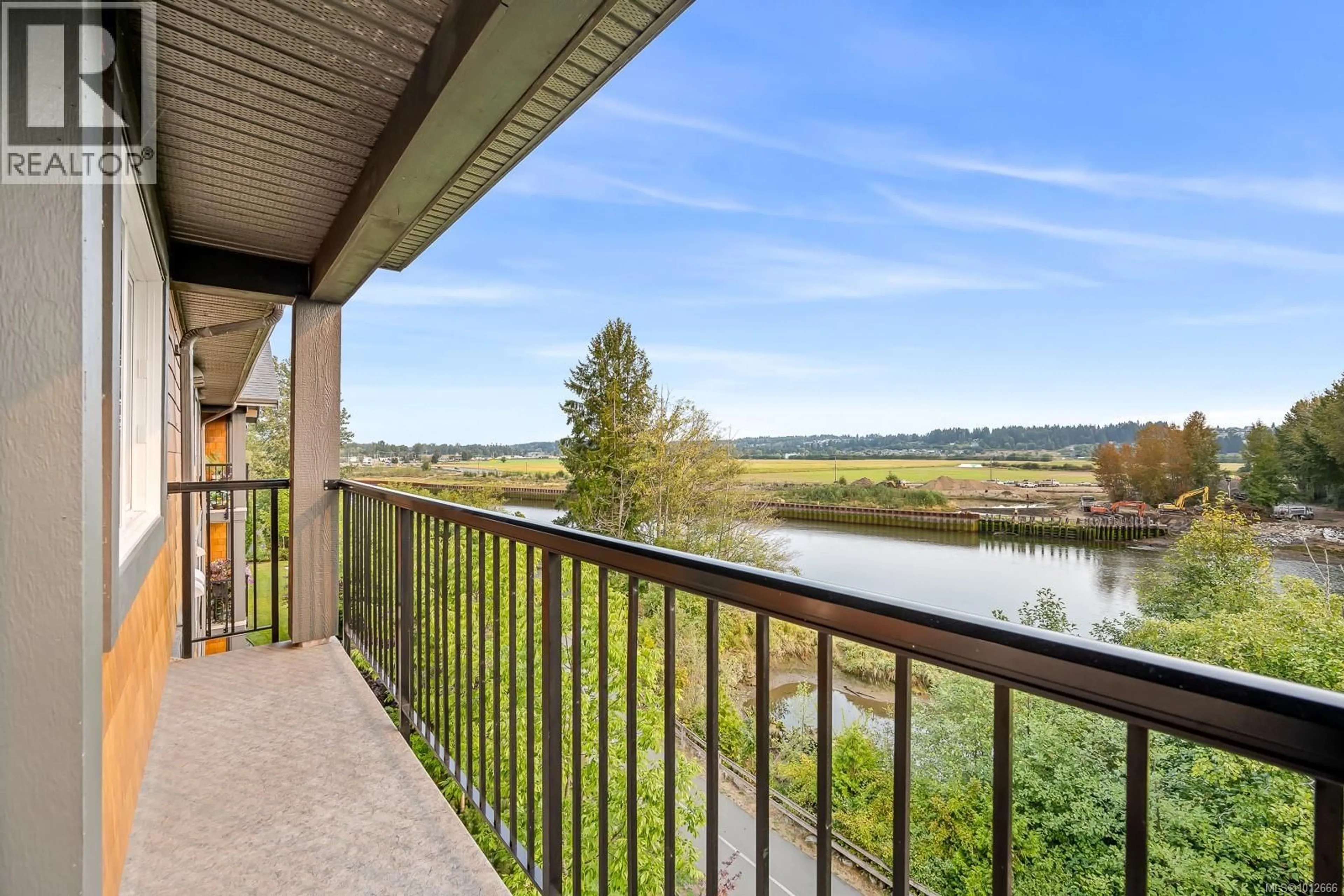 Balcony in the apartment, water/lake/river/ocean view for 411 - 1944 RIVERSIDE LANE, Courtenay British Columbia V9N0E5