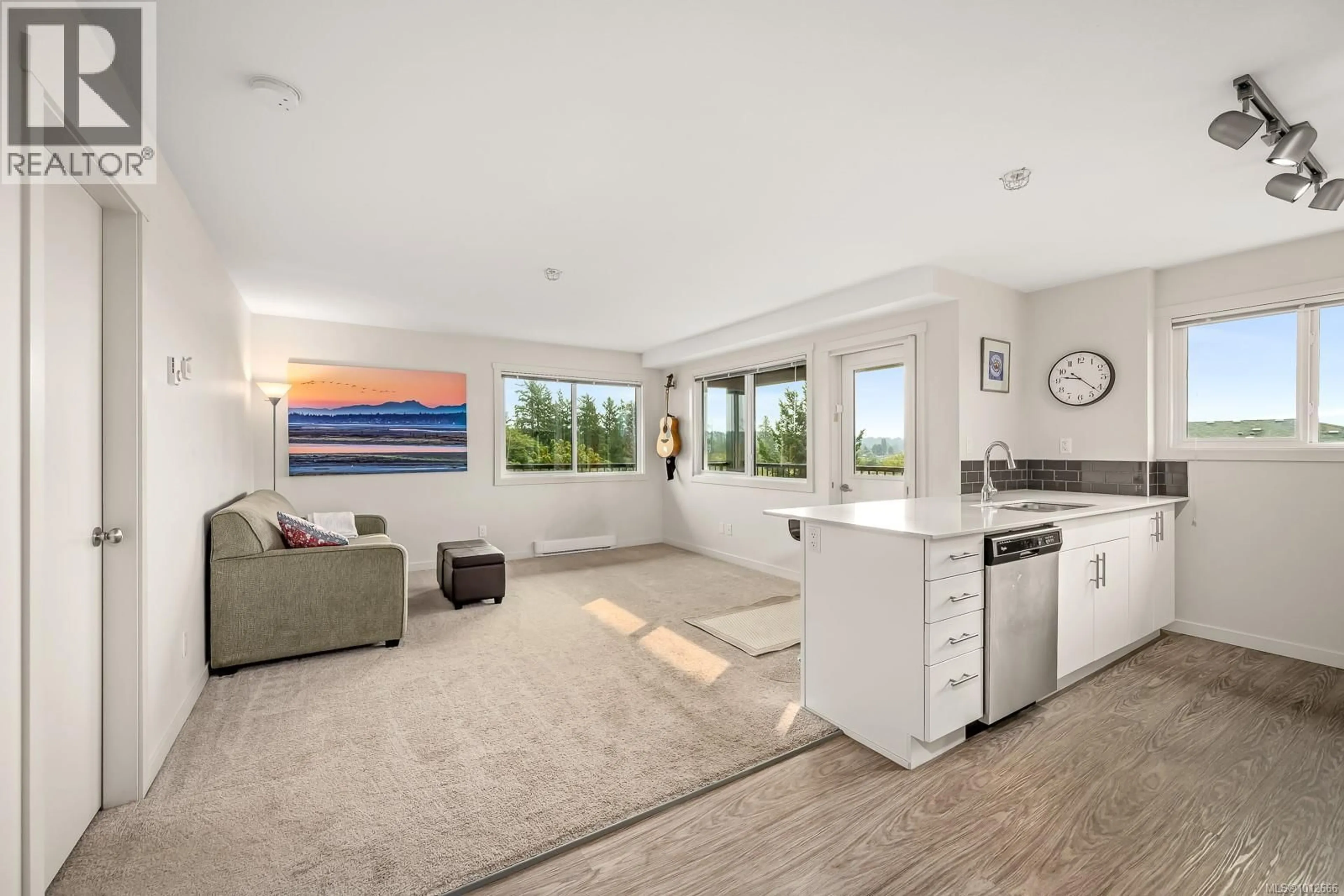 Open concept kitchen, ceramic/tile floor for 411 - 1944 RIVERSIDE LANE, Courtenay British Columbia V9N0E5