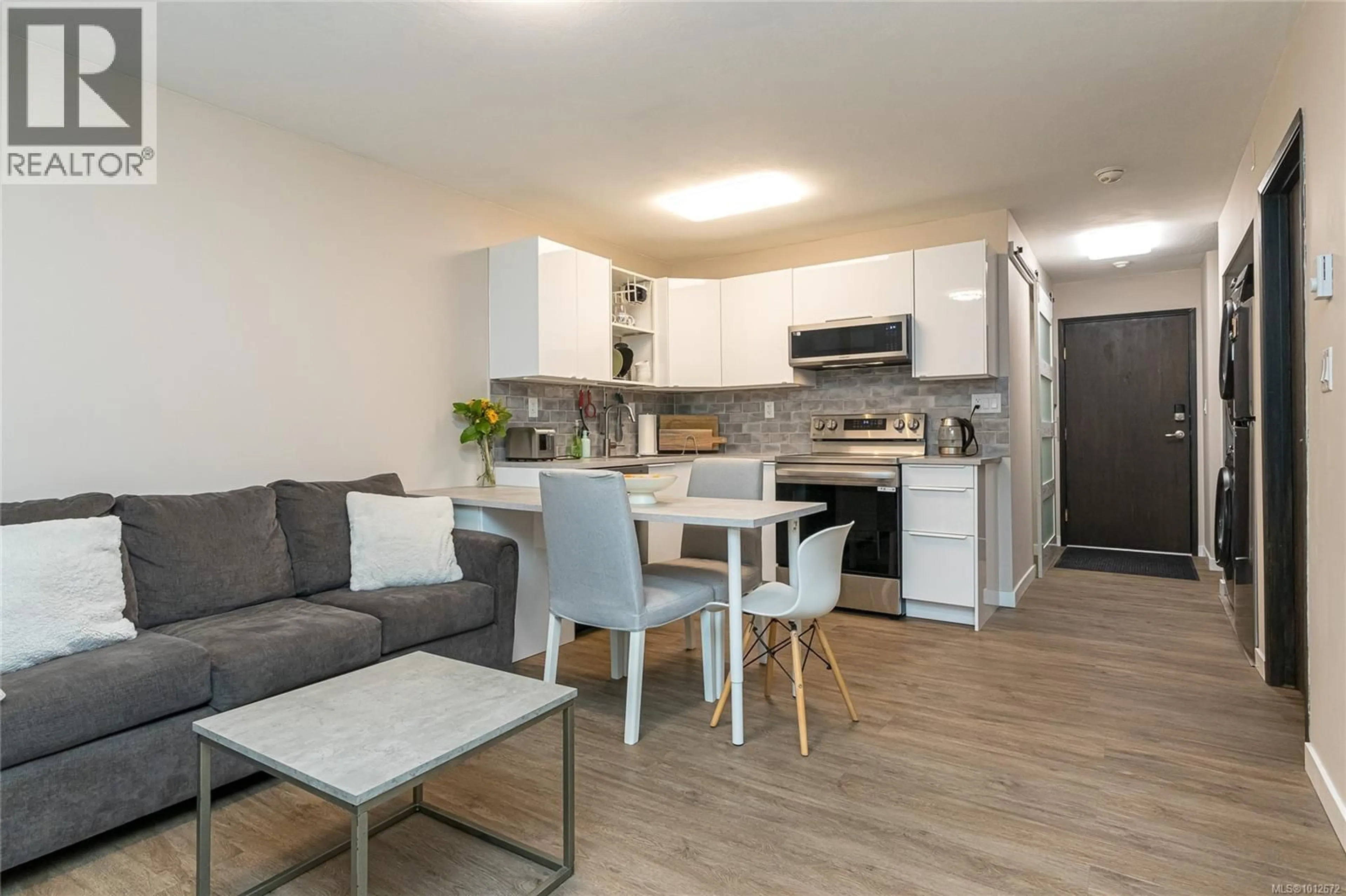 Open concept kitchen, wood/laminate floor for 106 - 2520 WARK STREET, Victoria British Columbia V8T5G6