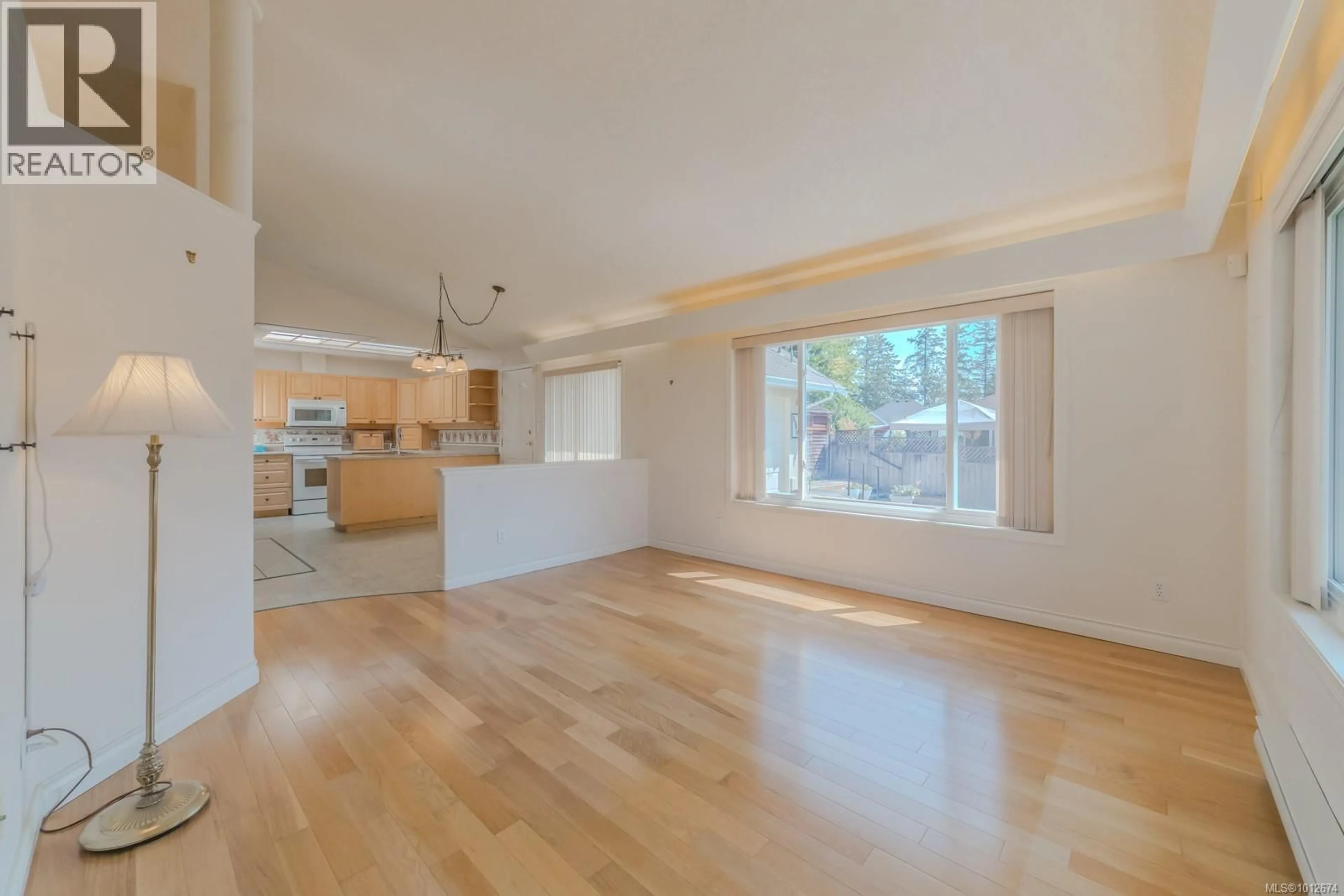Open concept kitchen, wood/laminate floor for 5949 JAYNES ROAD, Duncan British Columbia V9L3C4