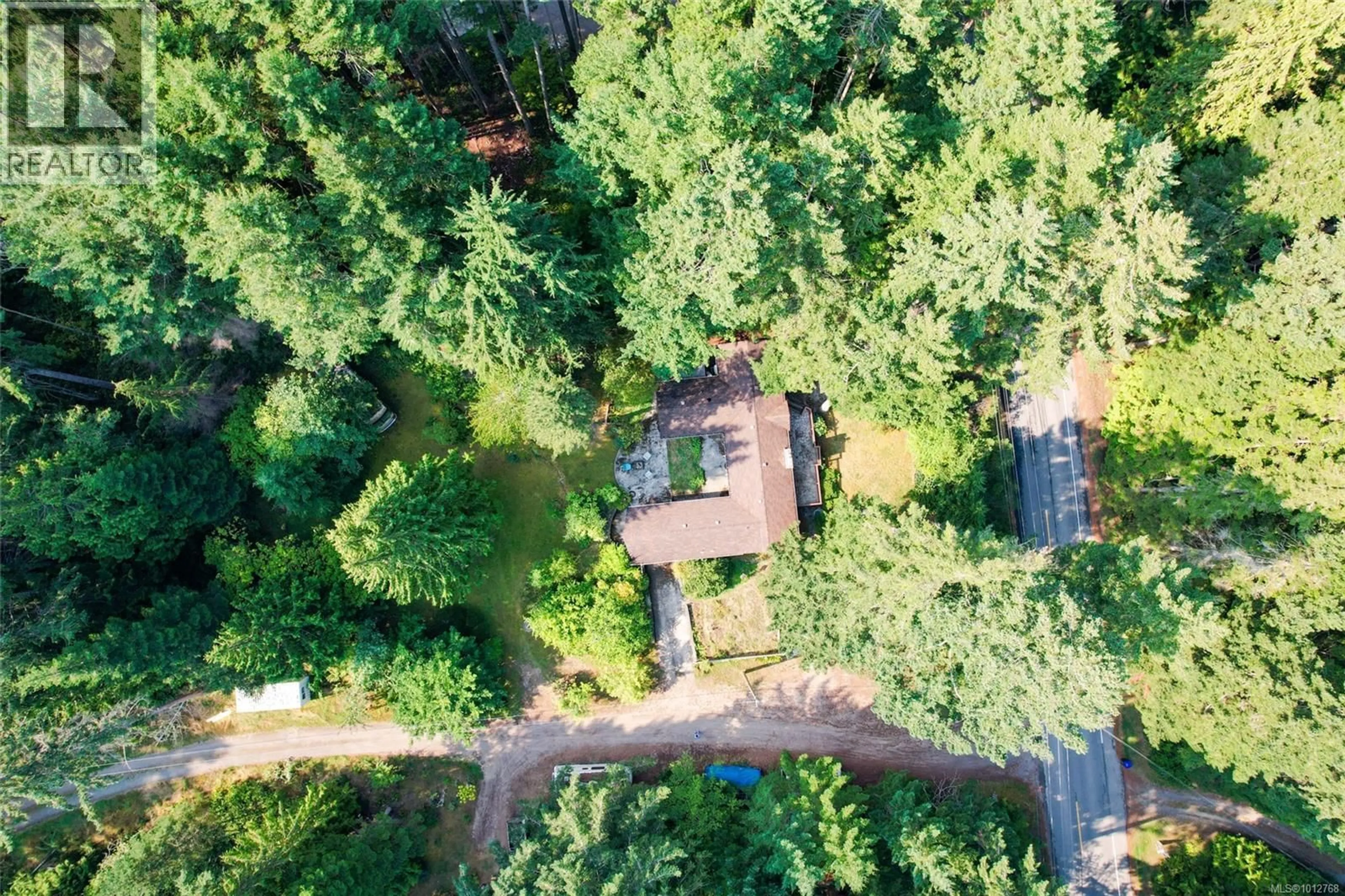 A pic from outside/outdoor area/front of a property/back of a property/a pic from drone, forest/trees view for 451 BERRY POINT ROAD, Gabriola Island British Columbia V0R1X1
