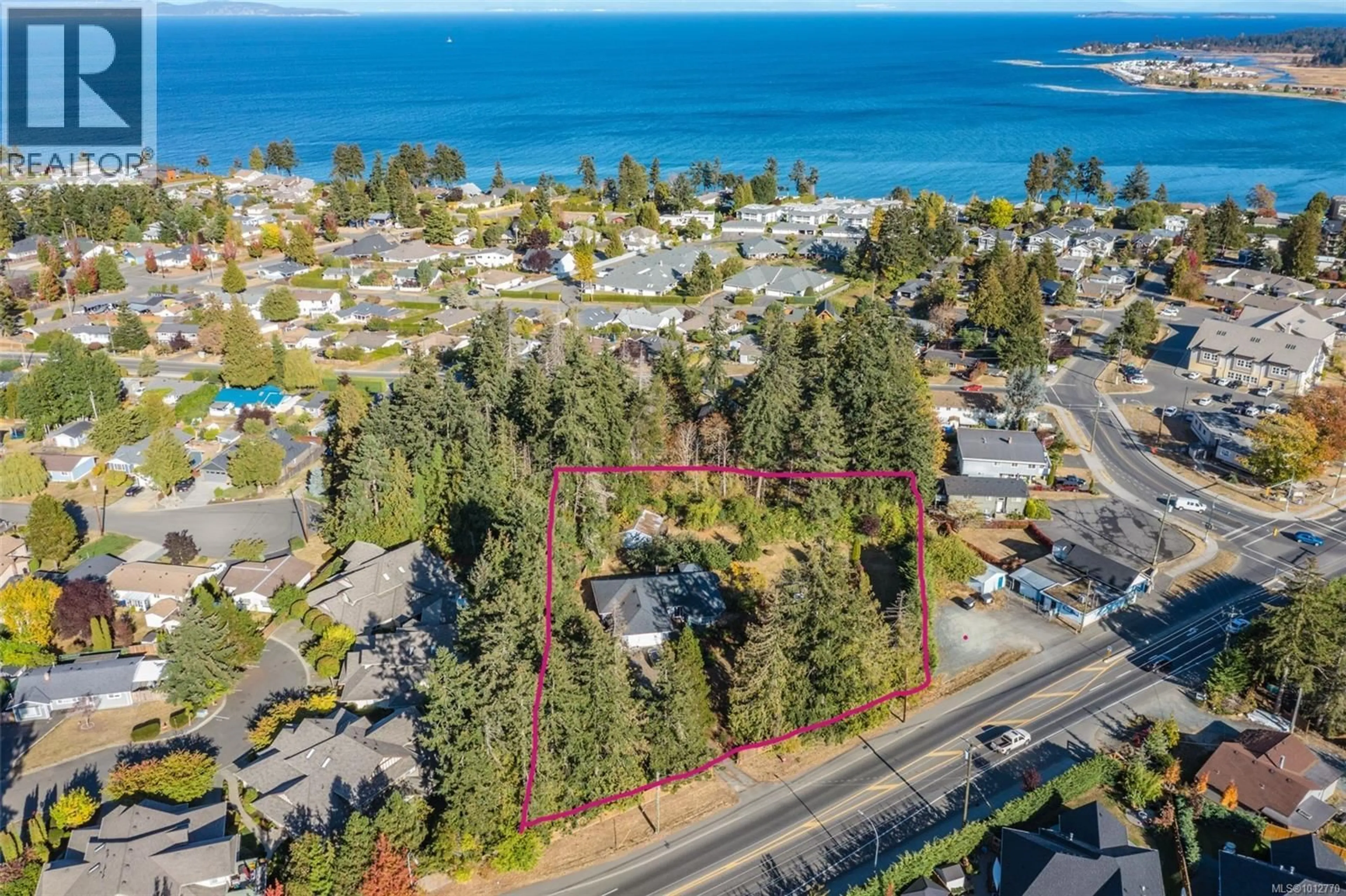 A pic from outside/outdoor area/front of a property/back of a property/a pic from drone, water/lake/river/ocean view for 563 ISLAND HIGHWAY WEST, Parksville British Columbia V9P1C7