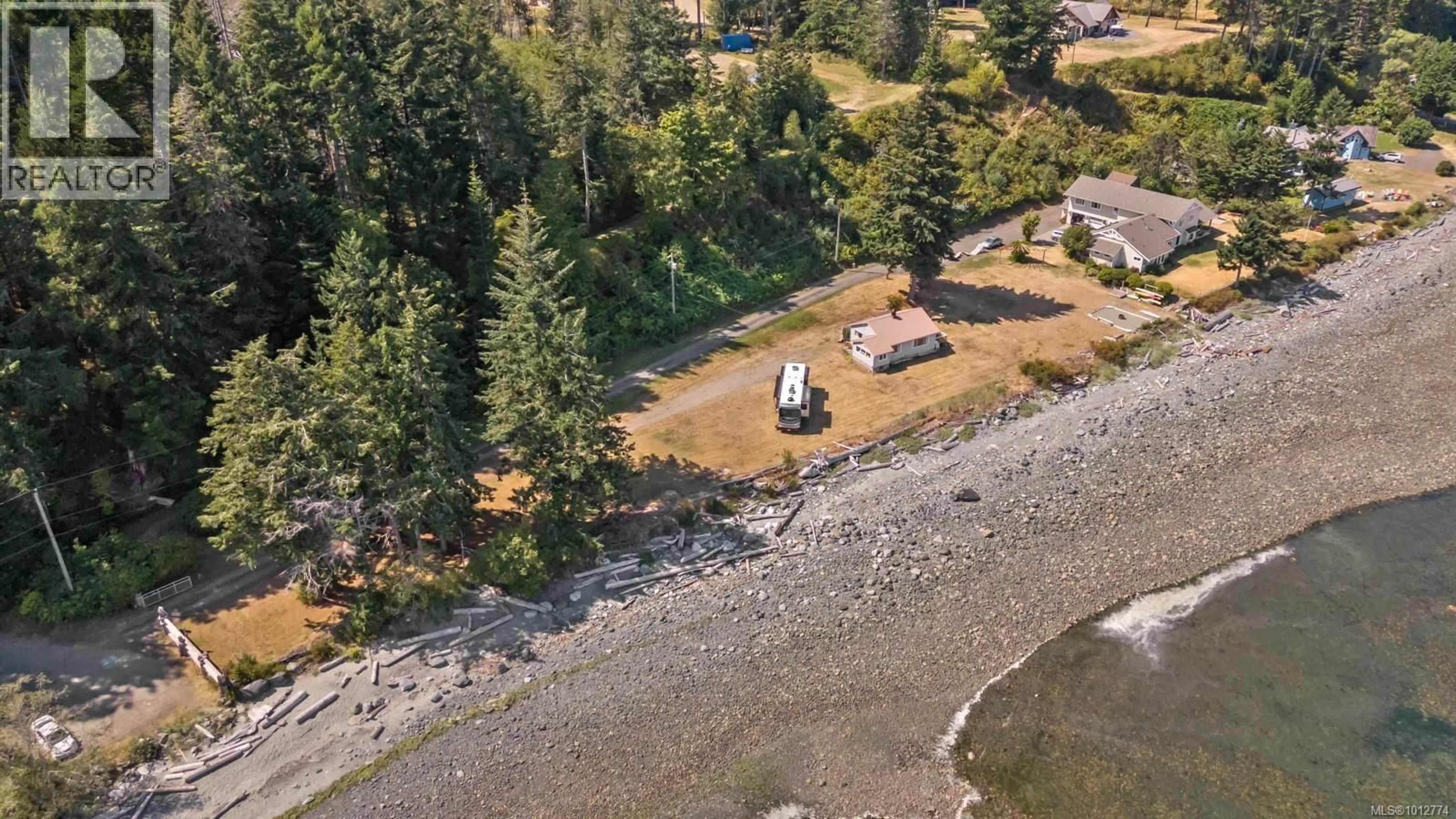 A pic from outside/outdoor area/front of a property/back of a property/a pic from drone, water/lake/river/ocean view for 1494 WILKINSON ROAD, Comox British Columbia V9M4B3