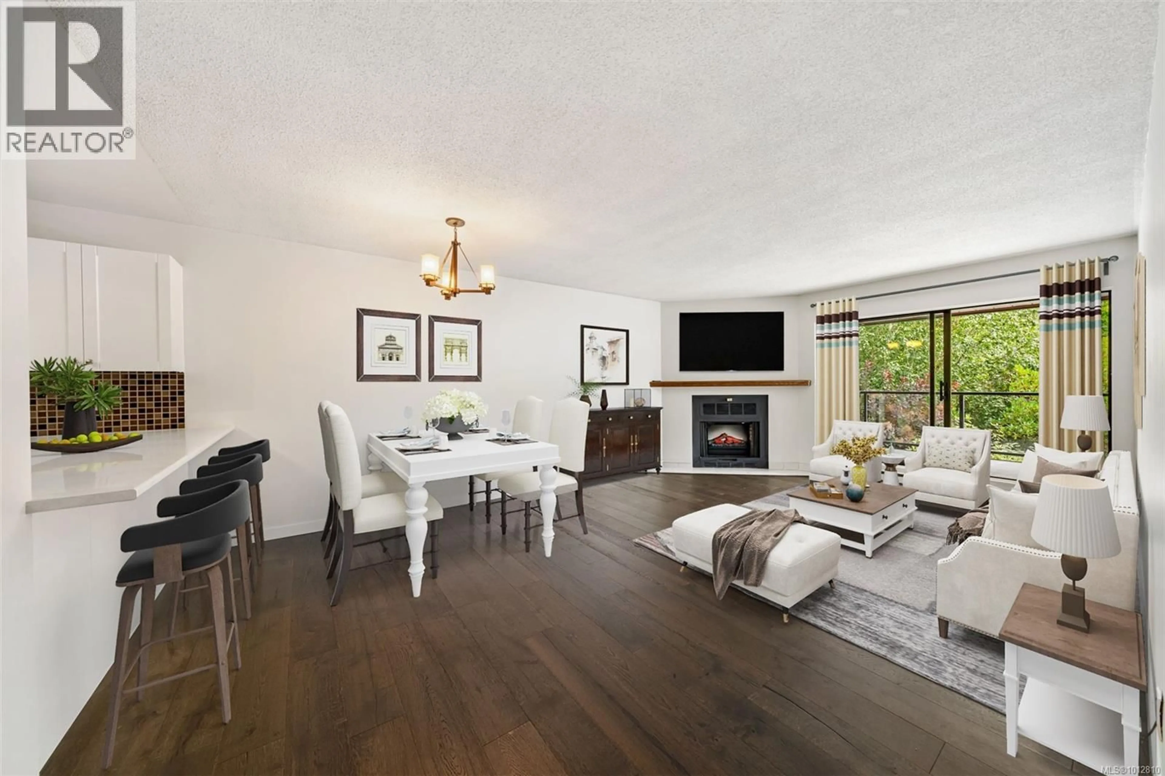 Living room with furniture, wood/laminate floor for 208 - 420 PARRY STREET, Victoria British Columbia V8V2H7