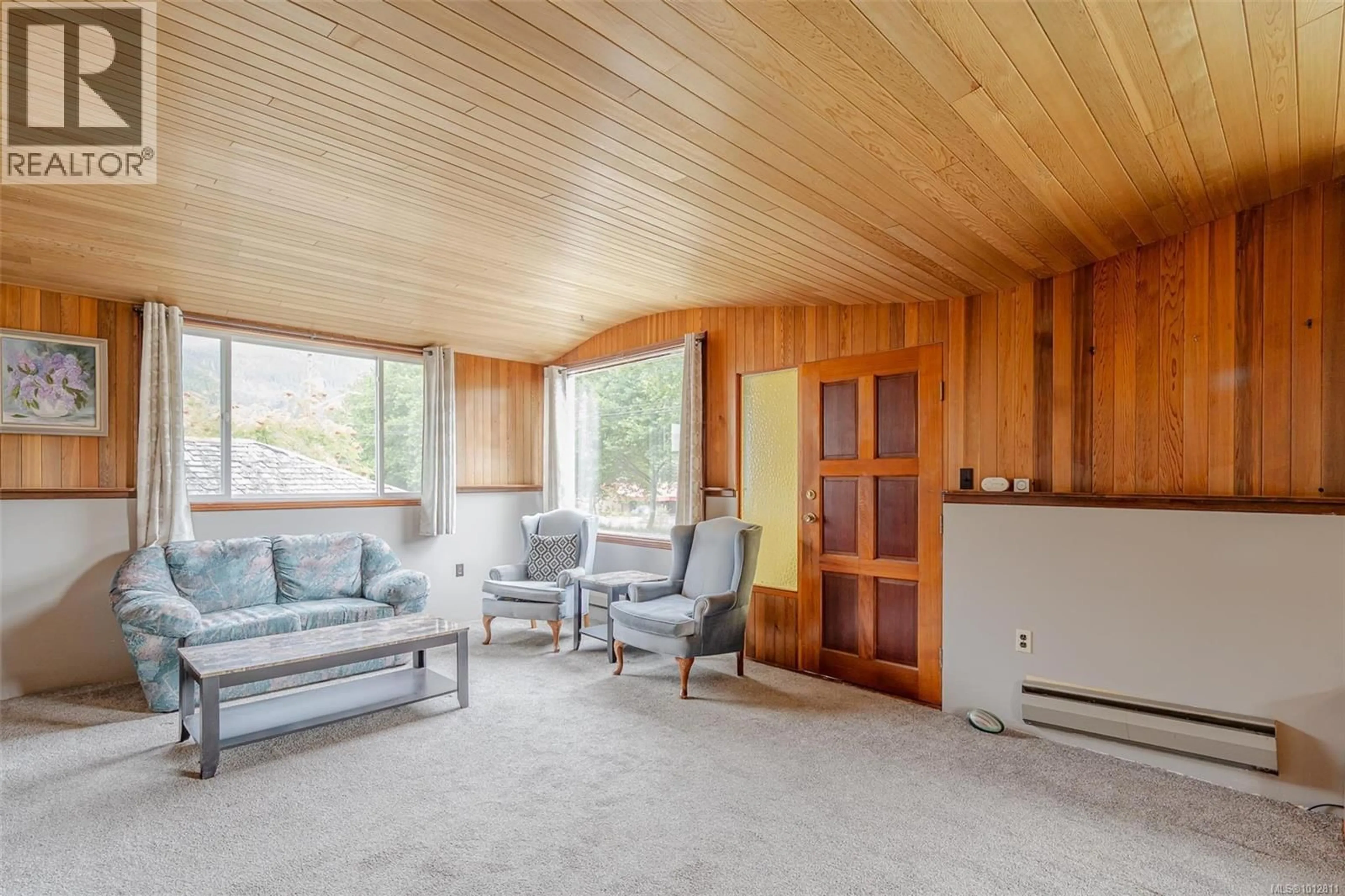 Living room with furniture, wood/laminate floor for 670 KELSEY WAY, Sayward British Columbia V0P1R0