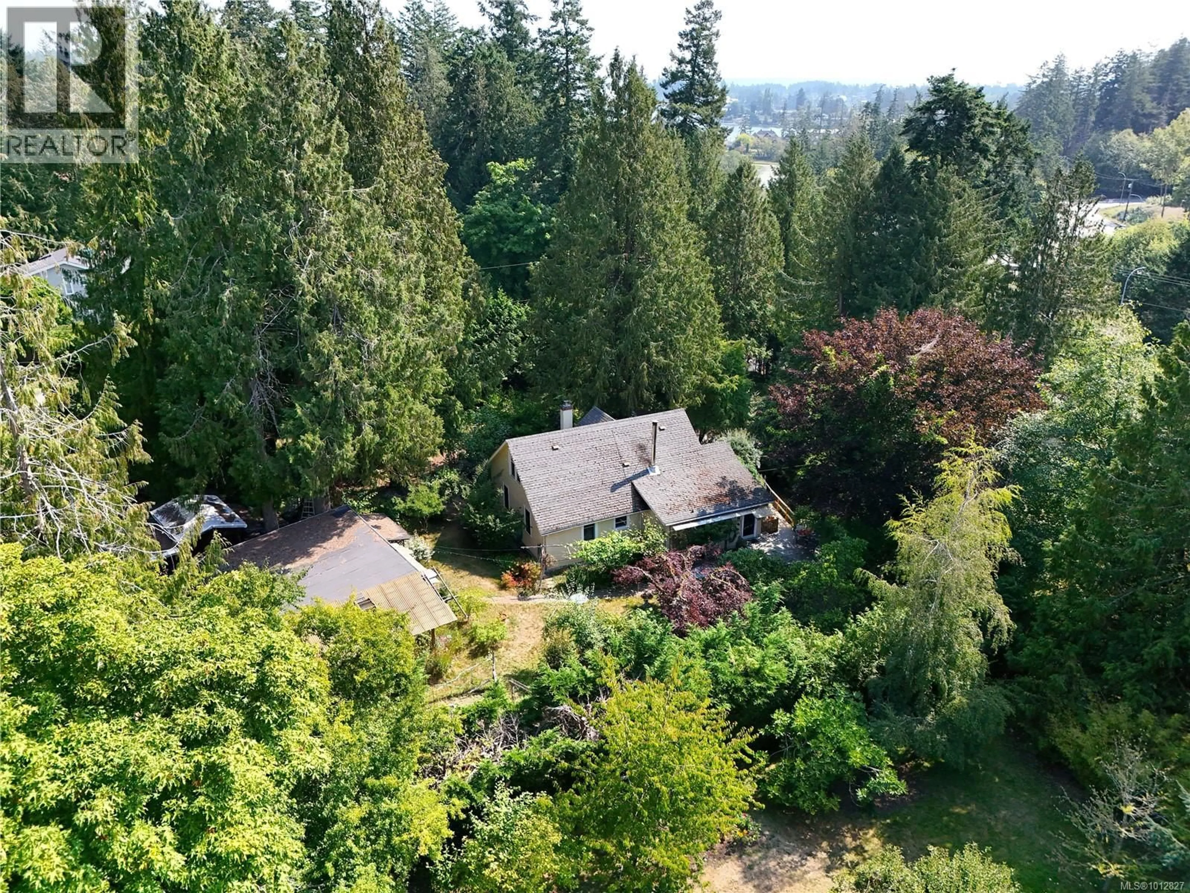 A pic from outside/outdoor area/front of a property/back of a property/a pic from drone, forest/trees view for 1720 SWARTZ BAY ROAD, North Saanich British Columbia V8L5R2