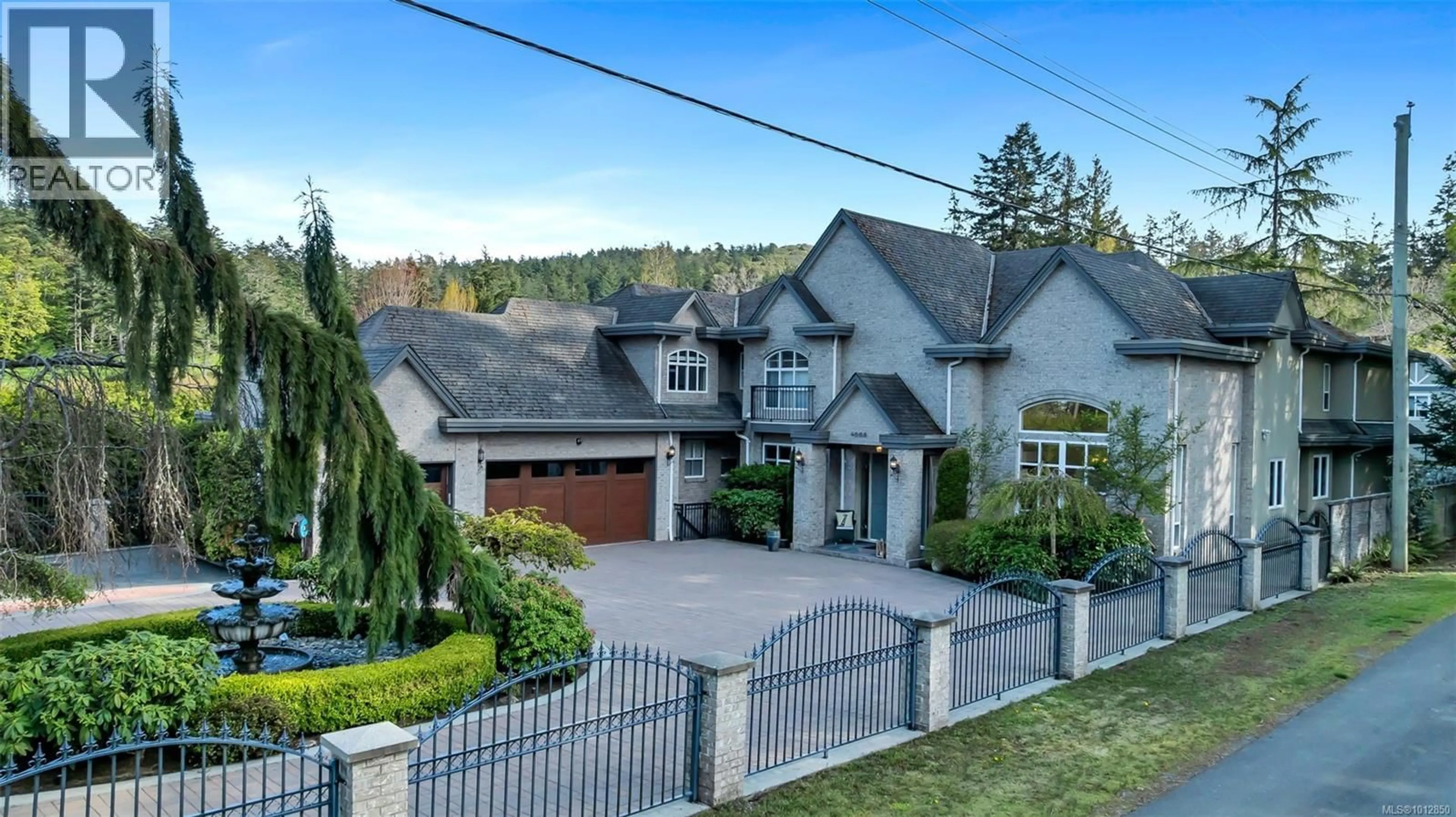 A pic from outside/outdoor area/front of a property/back of a property/a pic from drone, street for 4668 CORDOVA BAY ROAD, Saanich British Columbia V8X3V7