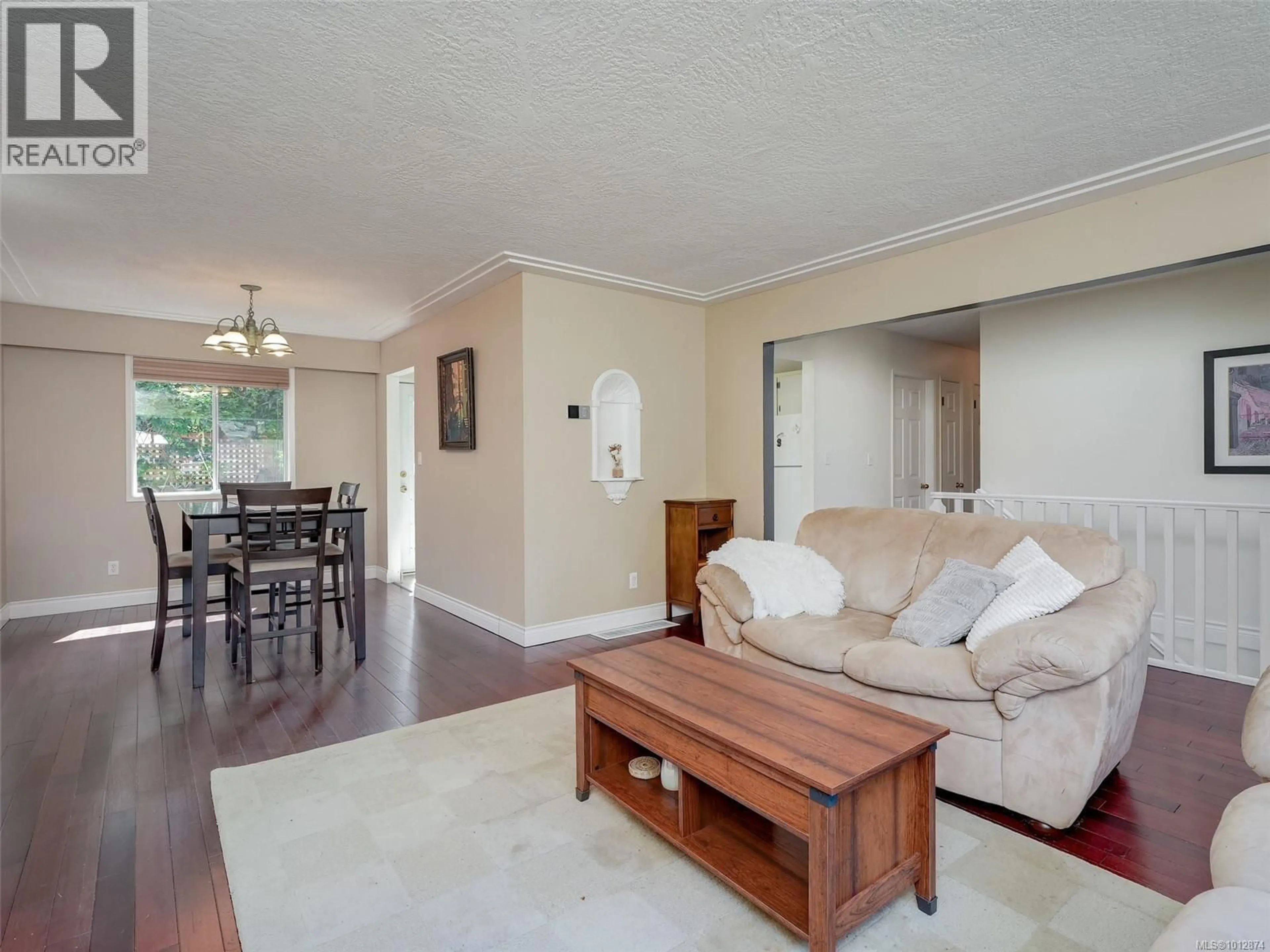 Living room with furniture, wood/laminate floor for 537 FARGO PLACE, Colwood British Columbia V9C2L9