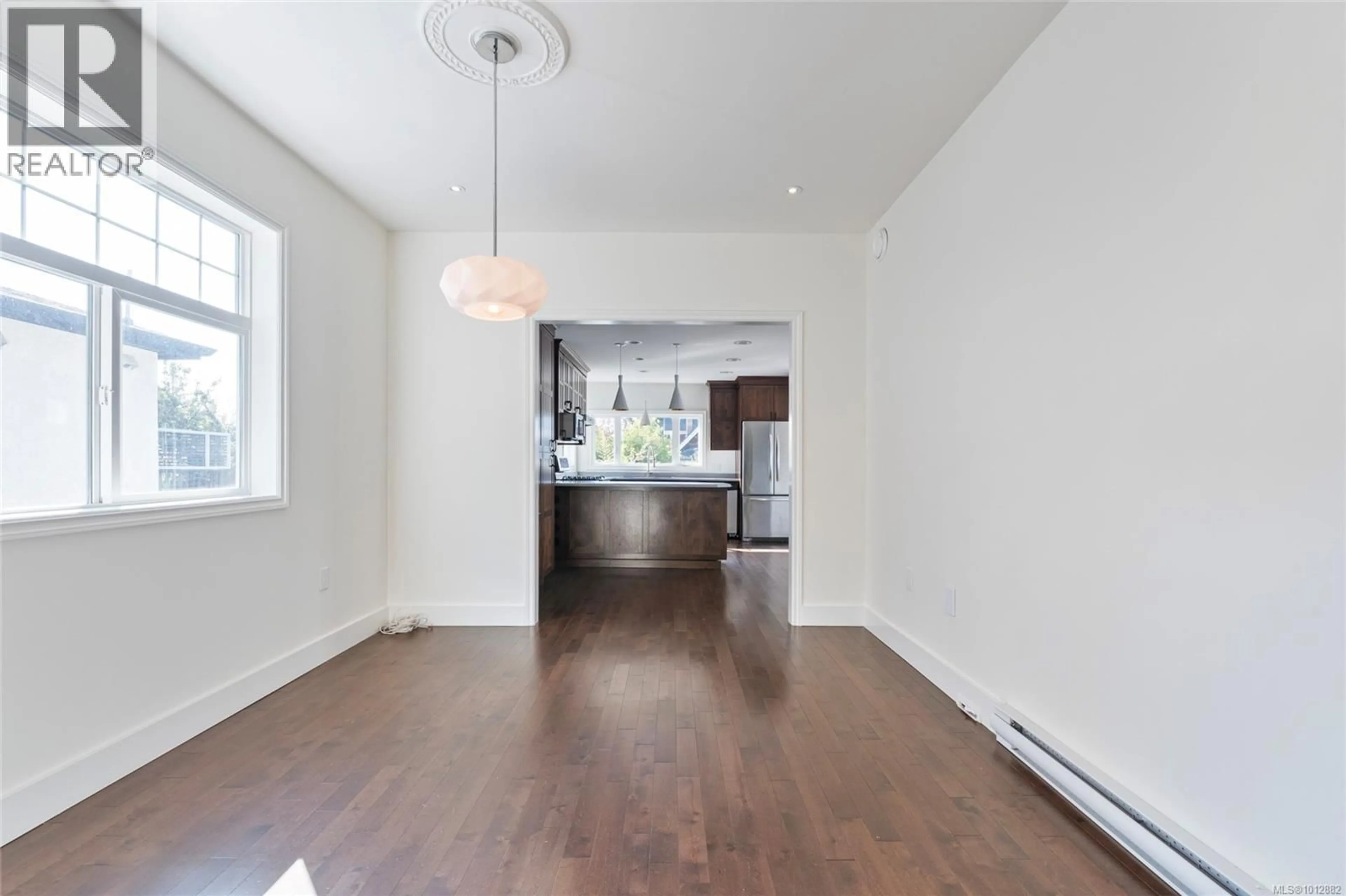 Open concept kitchen, wood/laminate floor for 658 PINE STREET, Victoria British Columbia V9A2Z8