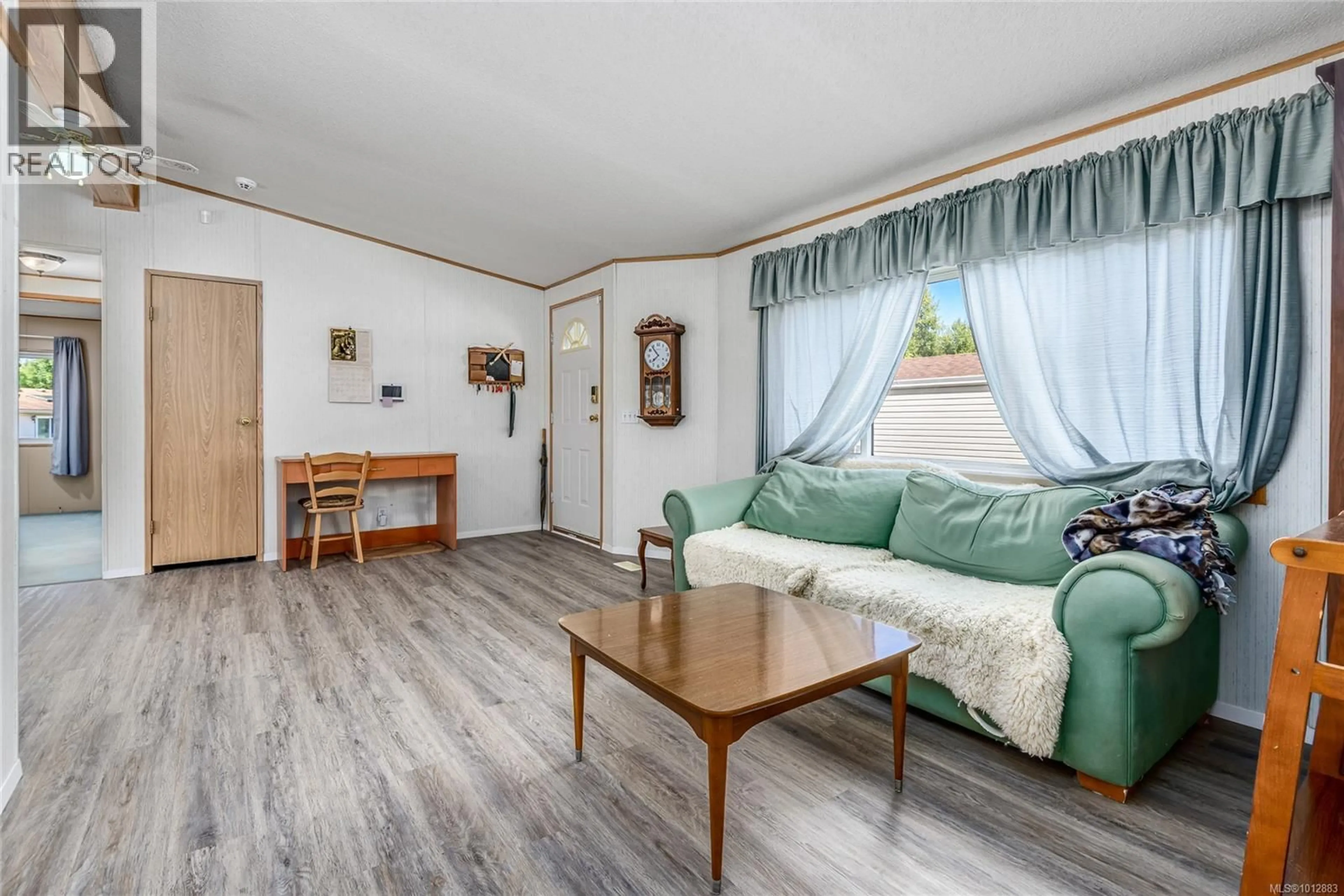 Living room with furniture, wood/laminate floor for 1 - 2200 LAMBERT DRIVE, Courtenay British Columbia V9N9E1