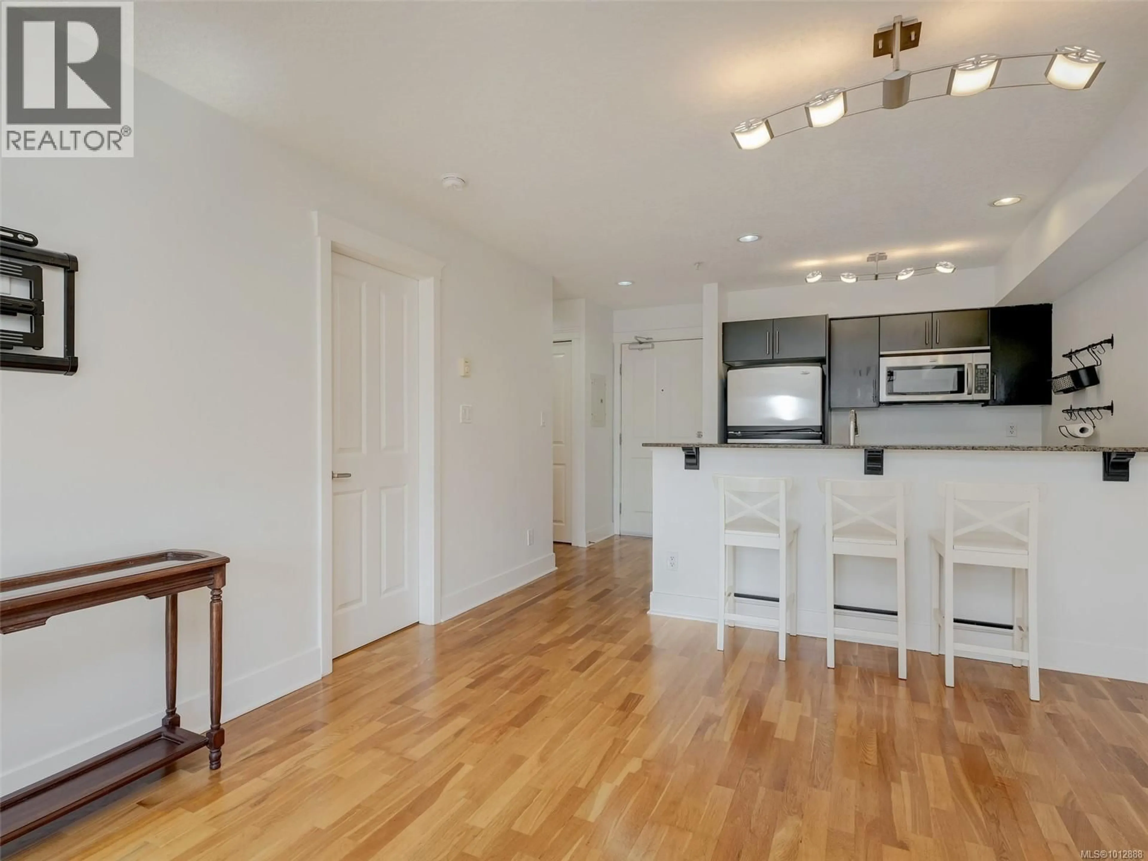 Open concept kitchen, wood/laminate floor for 305 - 2717 PEATT ROAD, Langford British Columbia V9B3V2