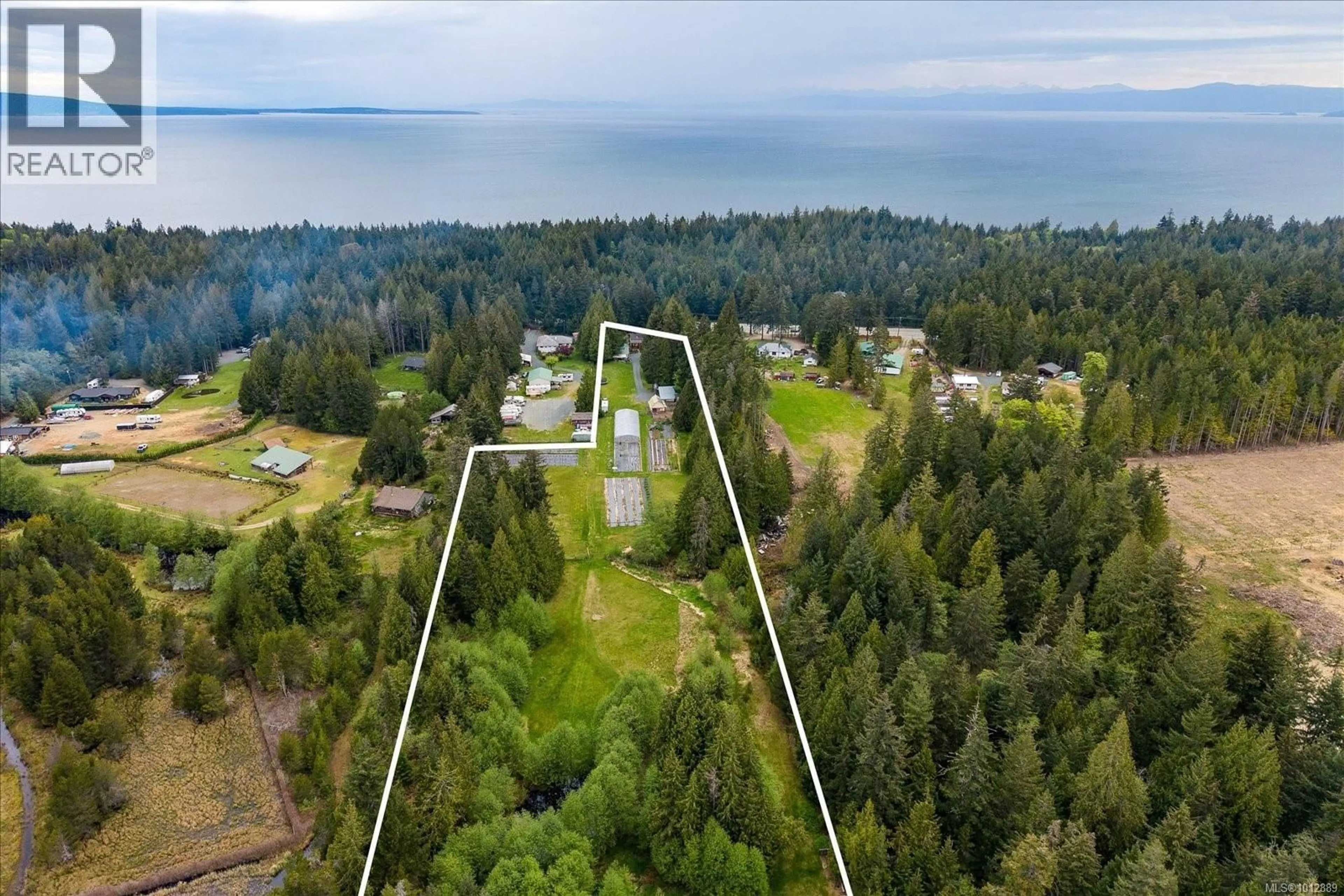 A pic from outside/outdoor area/front of a property/back of a property/a pic from drone, water/lake/river/ocean view for 4800 ISLAND HIGHWAY WEST, Qualicum Beach British Columbia V9K1Y9
