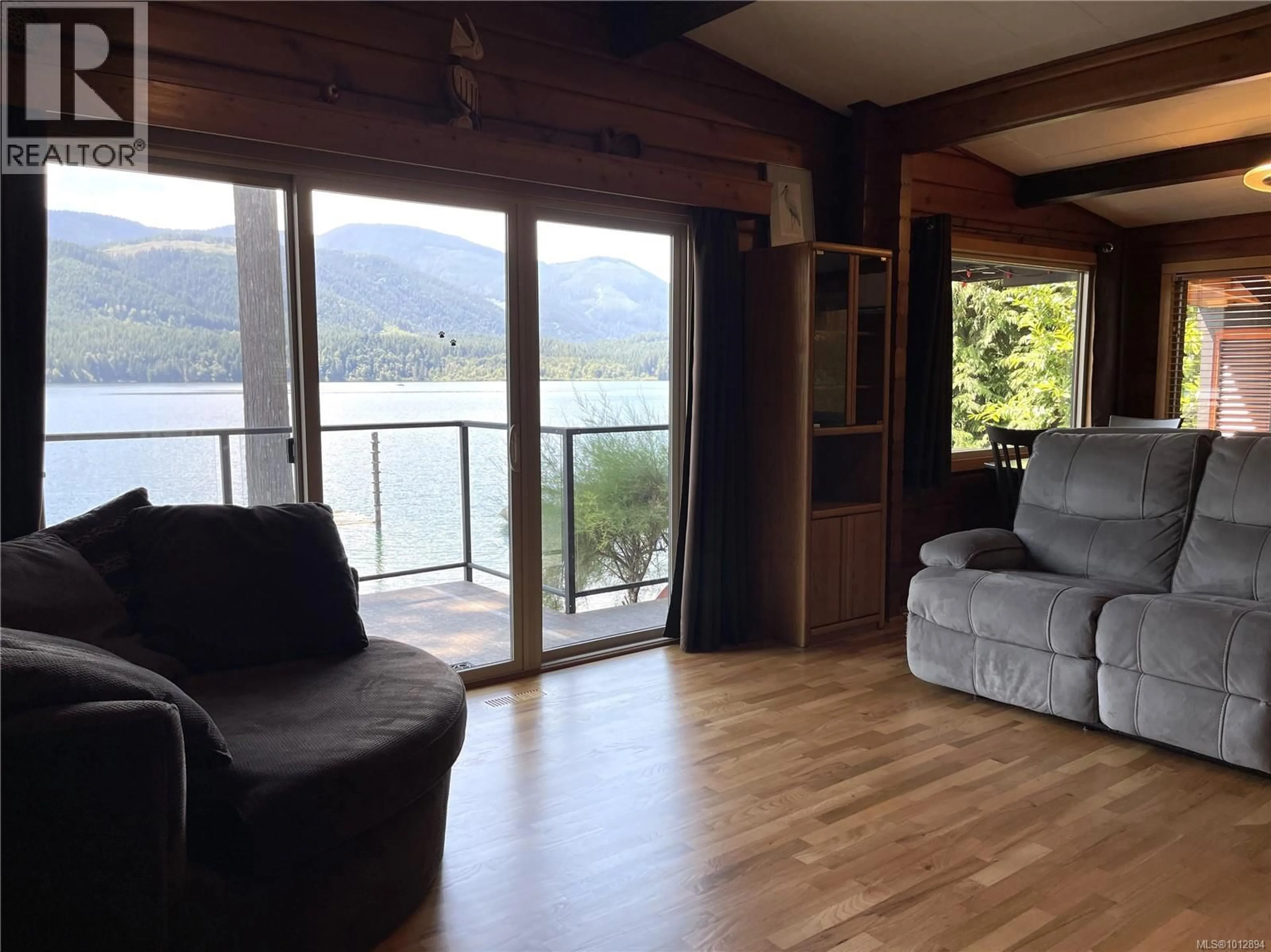 Living room with furniture, wood/laminate floor for 8856 STIRLING ARM DRIVE, Port Alberni British Columbia V9Y9E1