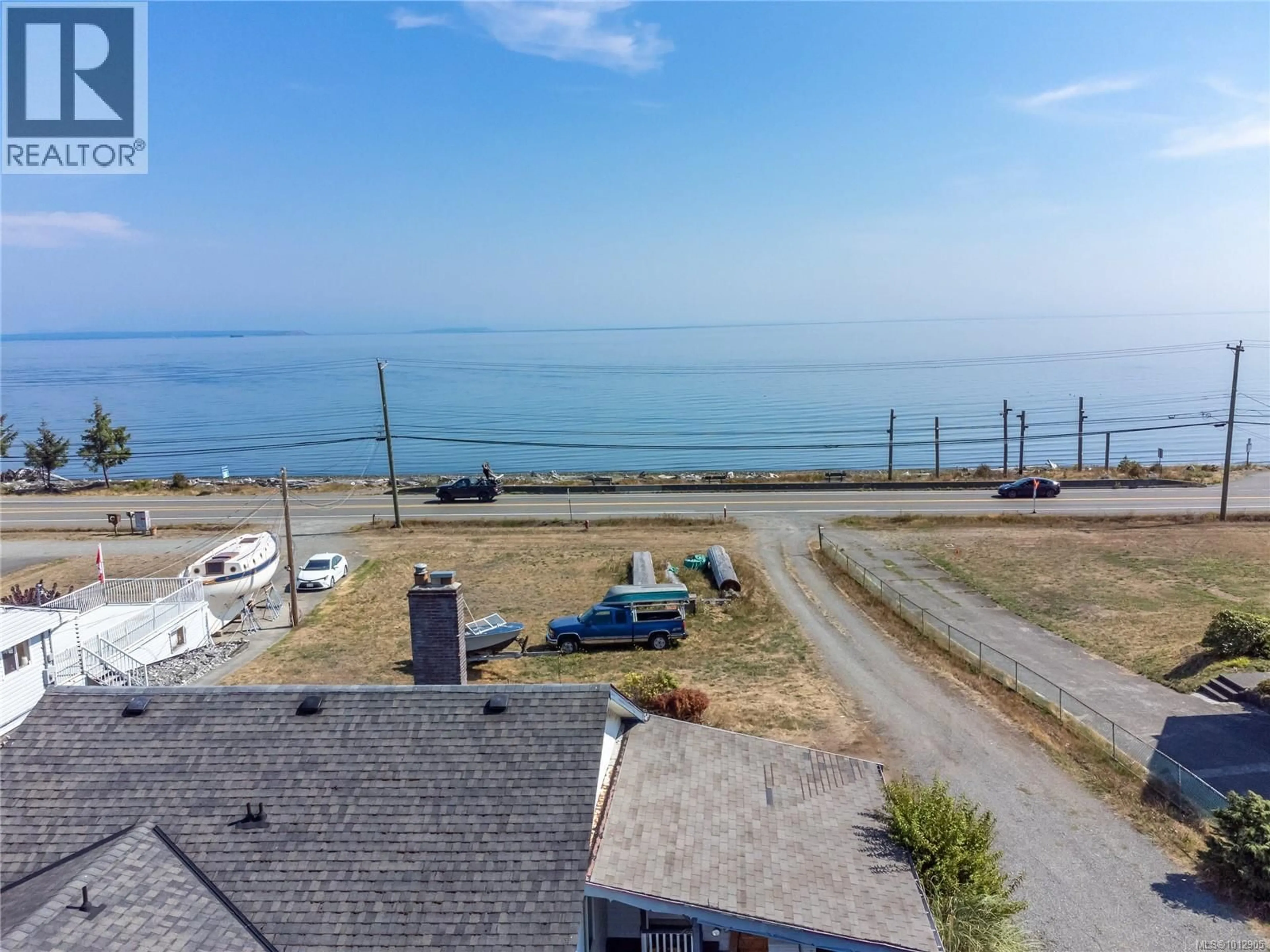 A pic from outside/outdoor area/front of a property/back of a property/a pic from drone, water/lake/river/ocean view for 3956 ISLAND HIGHWAY SOUTH, Campbell River British Columbia V9H1M9