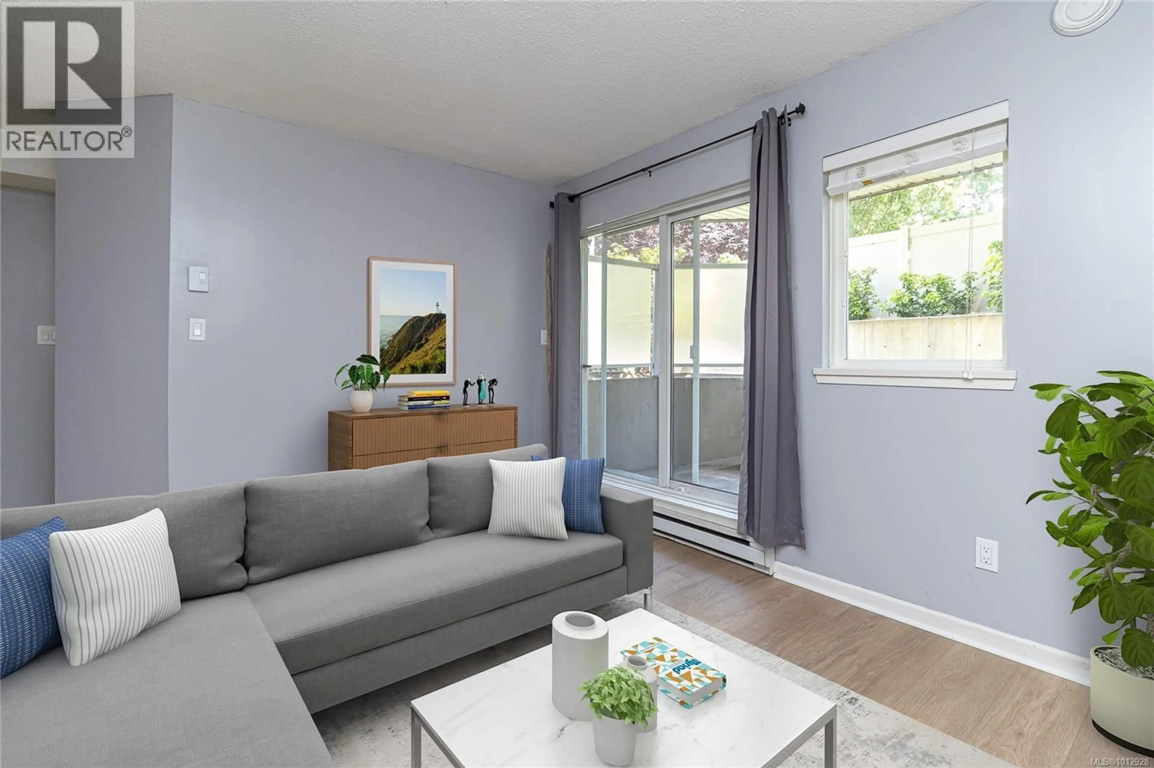 Living room with furniture, wood/laminate floor for 114 - 2520 WARK STREET, Victoria British Columbia V8T5G6