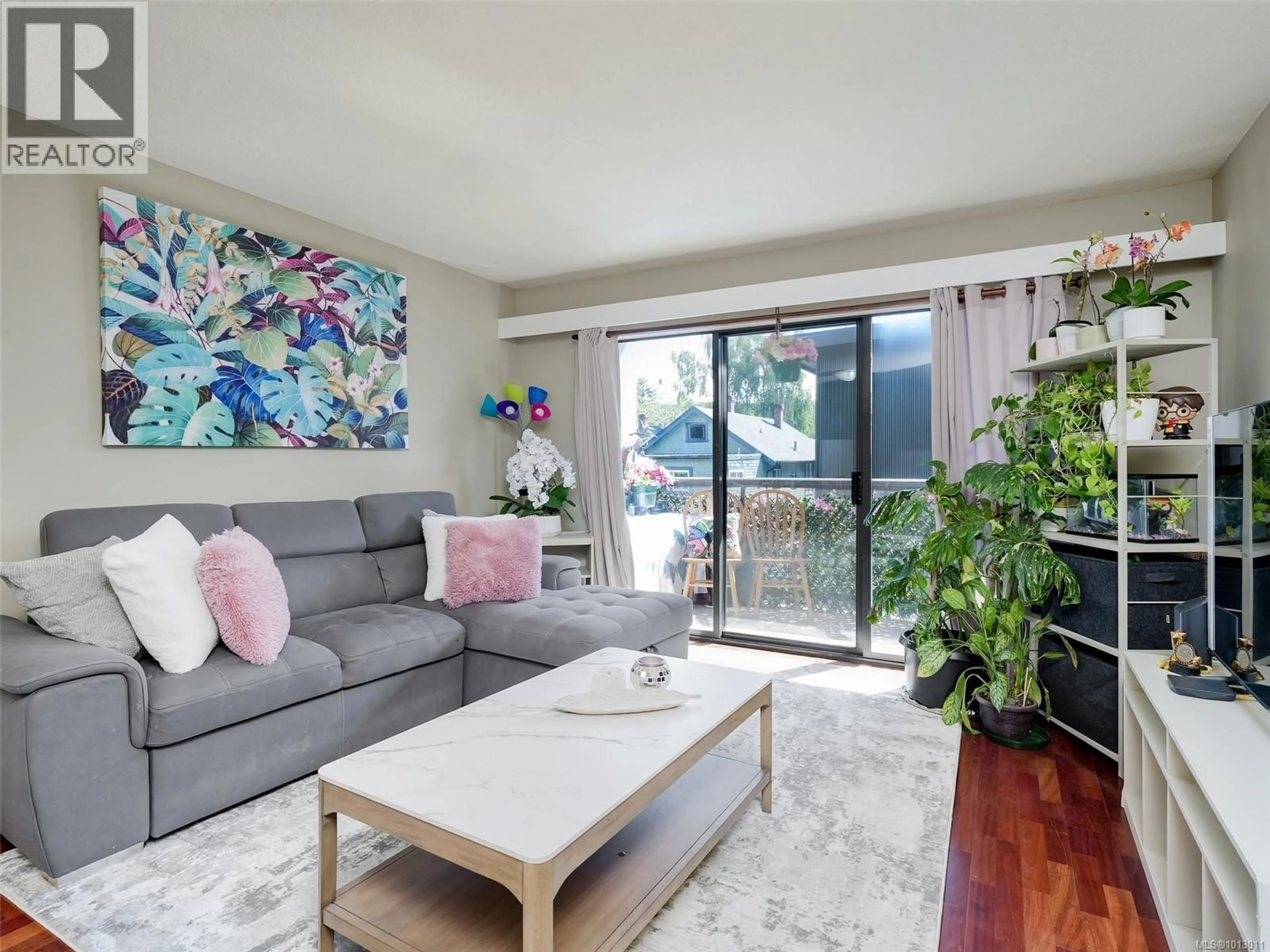 Living room with furniture, wood/laminate floor for 203 - 2747 QUADRA STREET, Victoria British Columbia V8T4E5