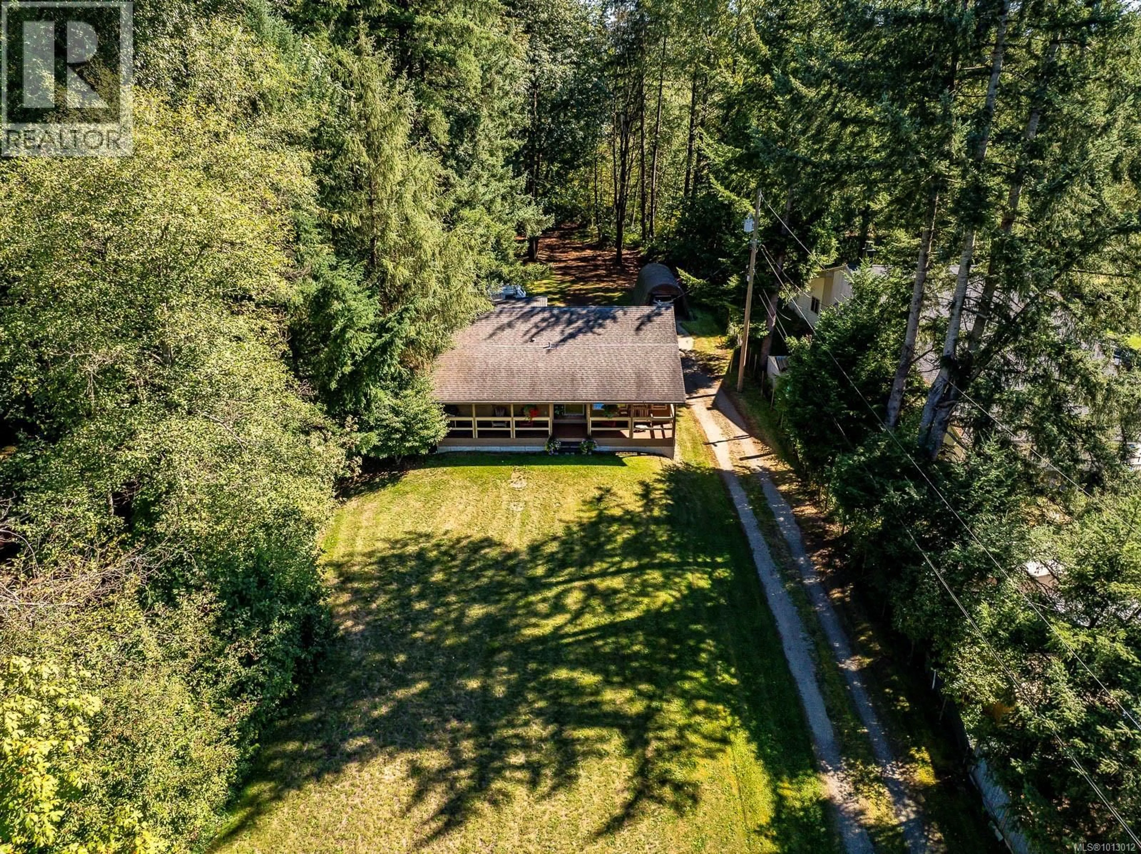 A pic from outside/outdoor area/front of a property/back of a property/a pic from drone, forest/trees view for 3465 CESSFORD ROAD, Courtenay British Columbia V9J1R4