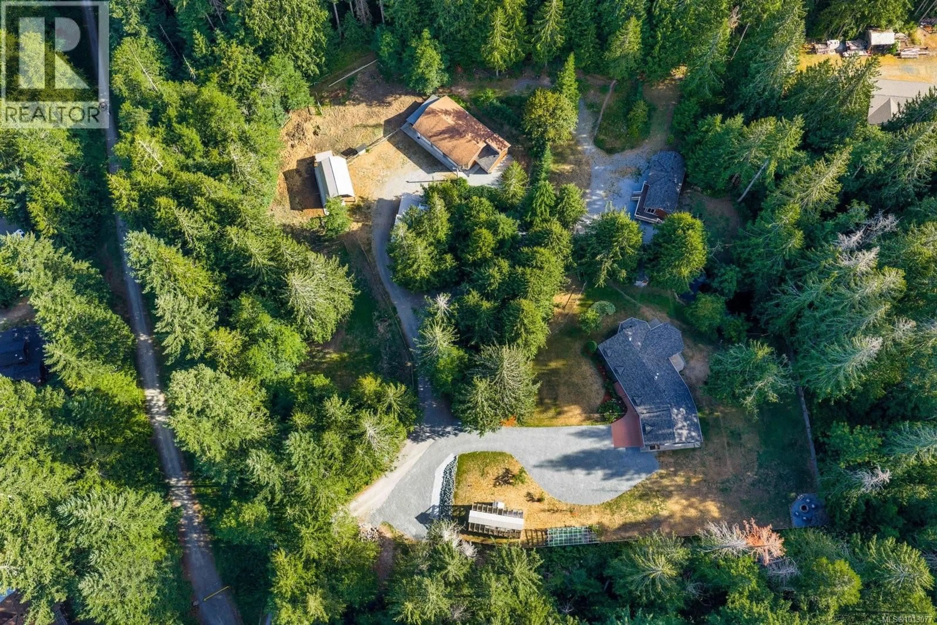 A pic from outside/outdoor area/front of a property/back of a property/a pic from drone, forest/trees view for 2656 MONCUR ROAD, Shawnigan Lake British Columbia V0R2W3