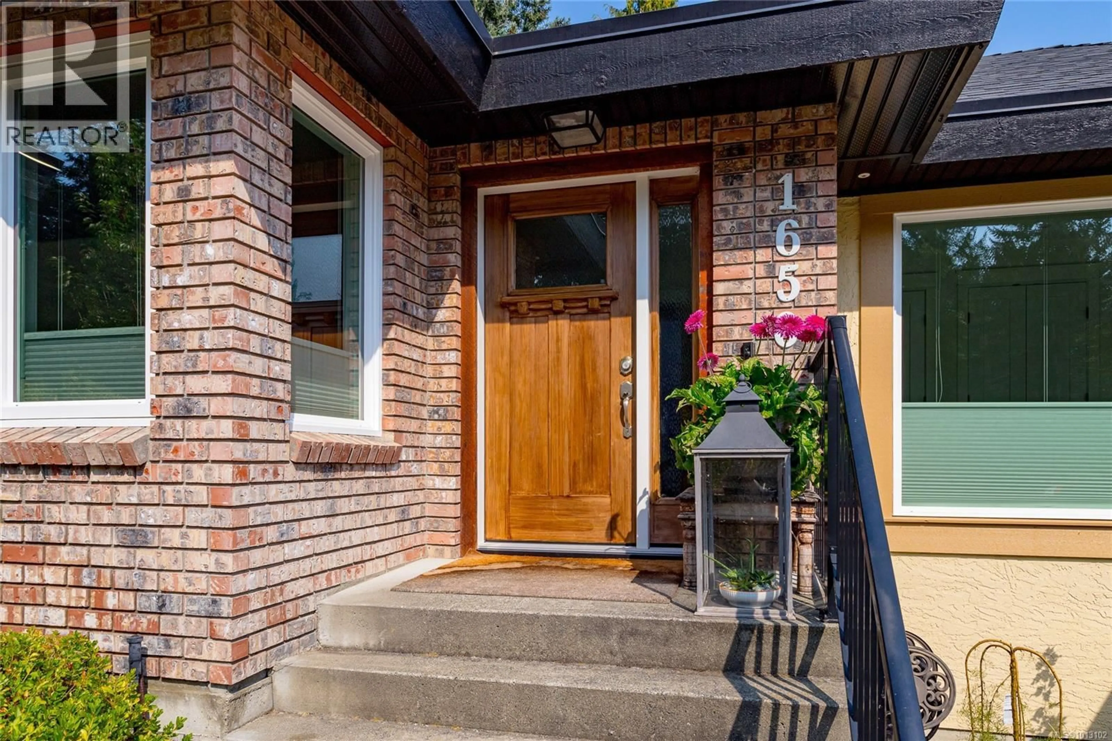 Home with brick exterior material, street for 1650 BARRETT DRIVE, North Saanich British Columbia V8L5A6