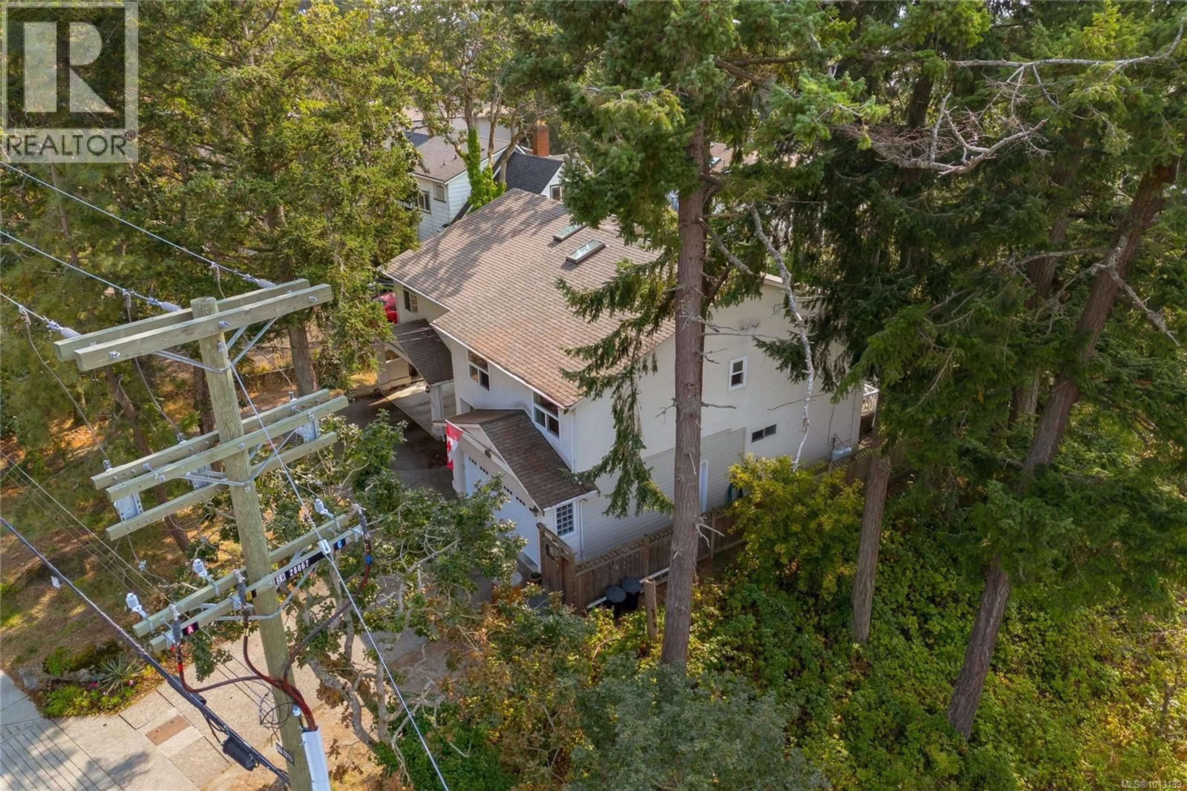A pic from outside/outdoor area/front of a property/back of a property/a pic from drone, forest/trees view for 999 ADMIRALS ROAD, Esquimalt British Columbia V9A2P1