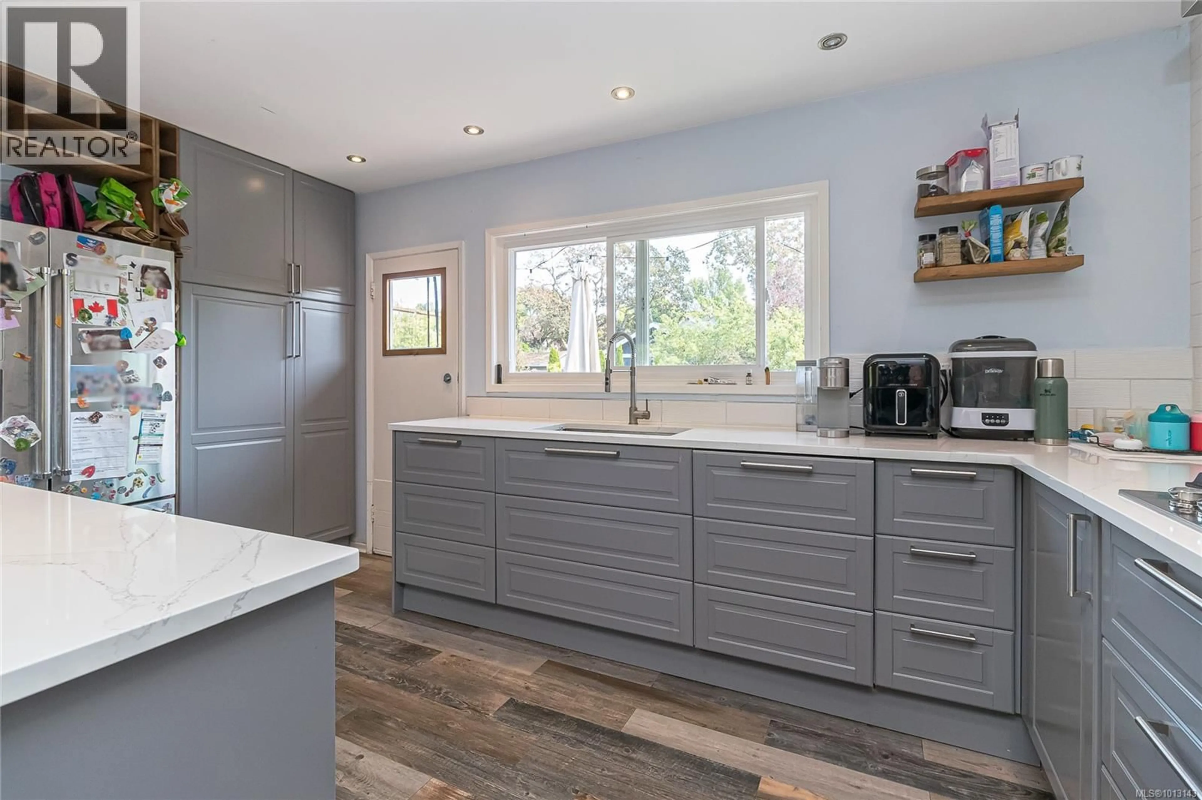 Contemporary kitchen, wood/laminate floor for 2847 INLET AVENUE, Saanich British Columbia V9A2M6