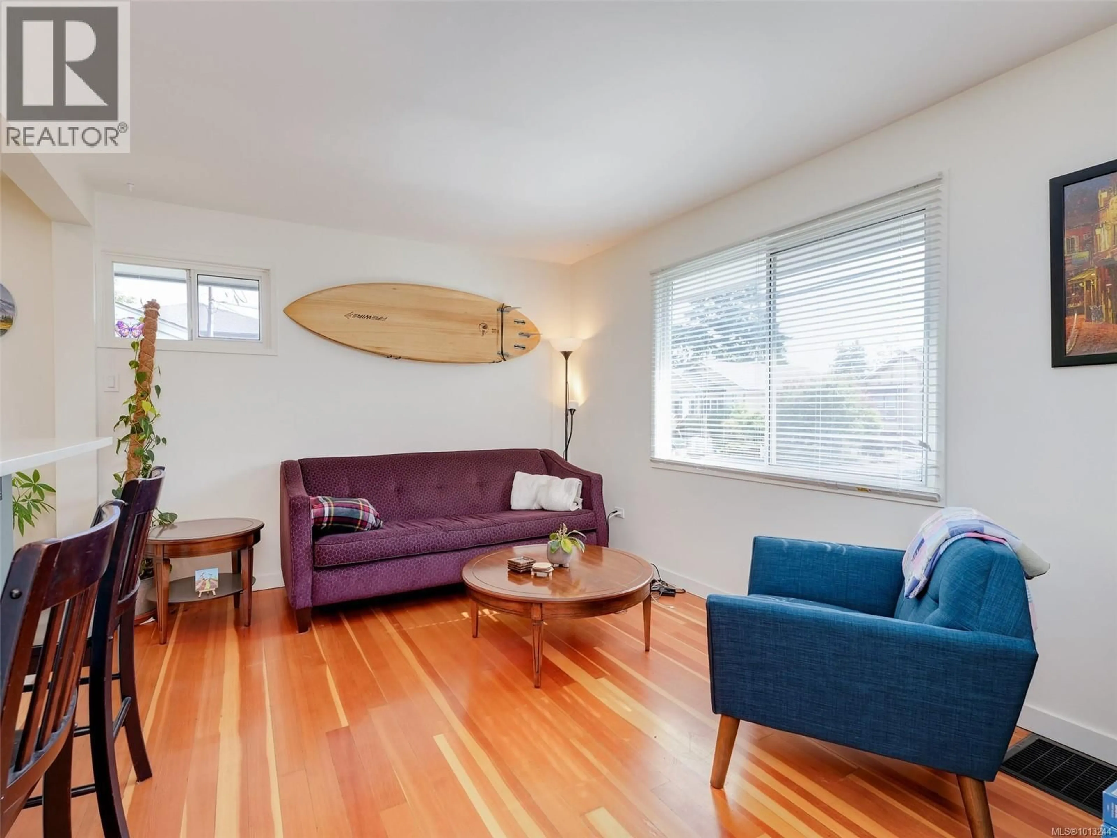 Living room with furniture, wood/laminate floor for 1728 FOUL BAY ROAD, Victoria British Columbia V8R5A4