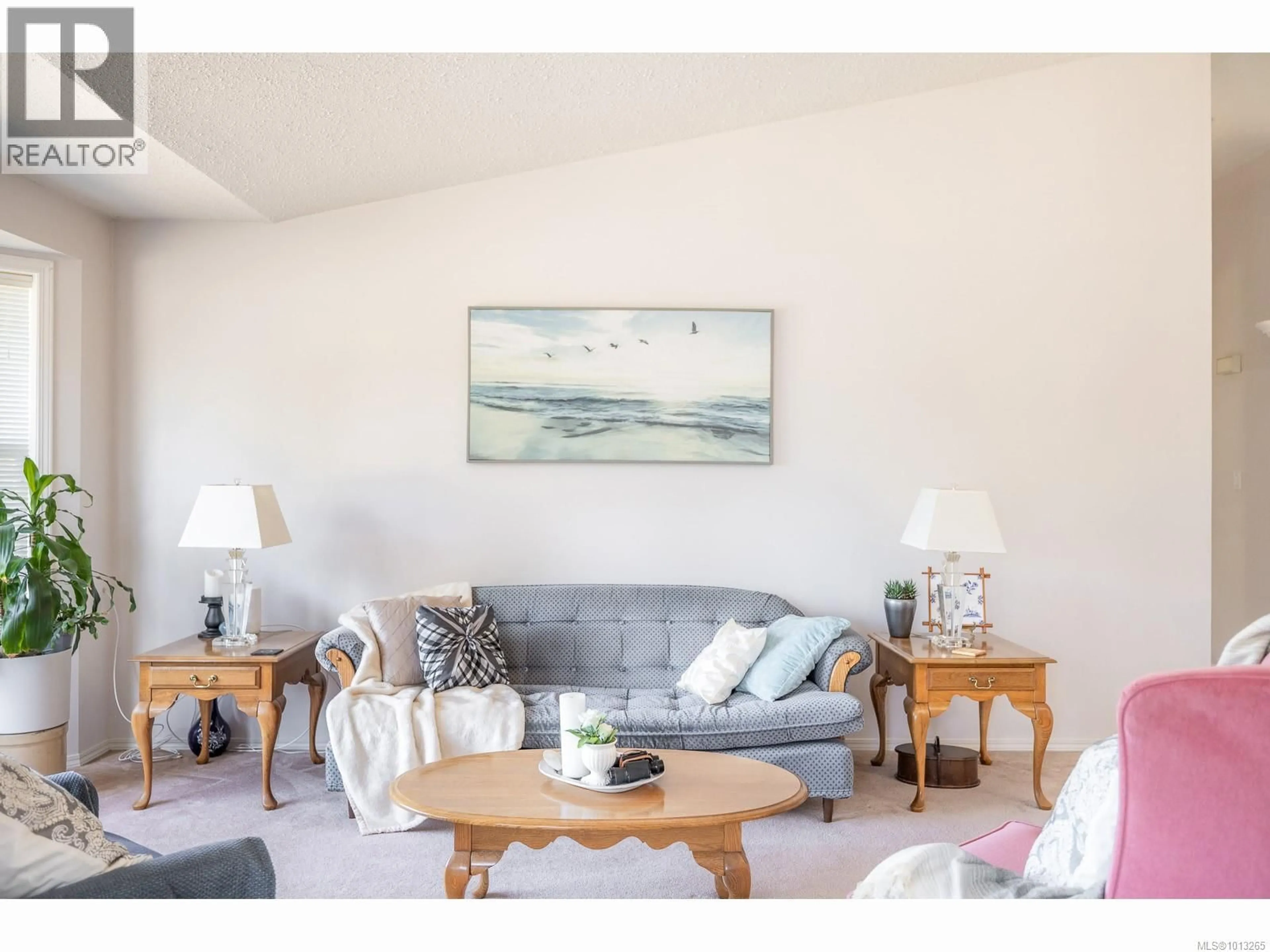 Living room with furniture, wood/laminate floor for 5399 LOST LAKE ROAD, Nanaimo British Columbia V9T5E7