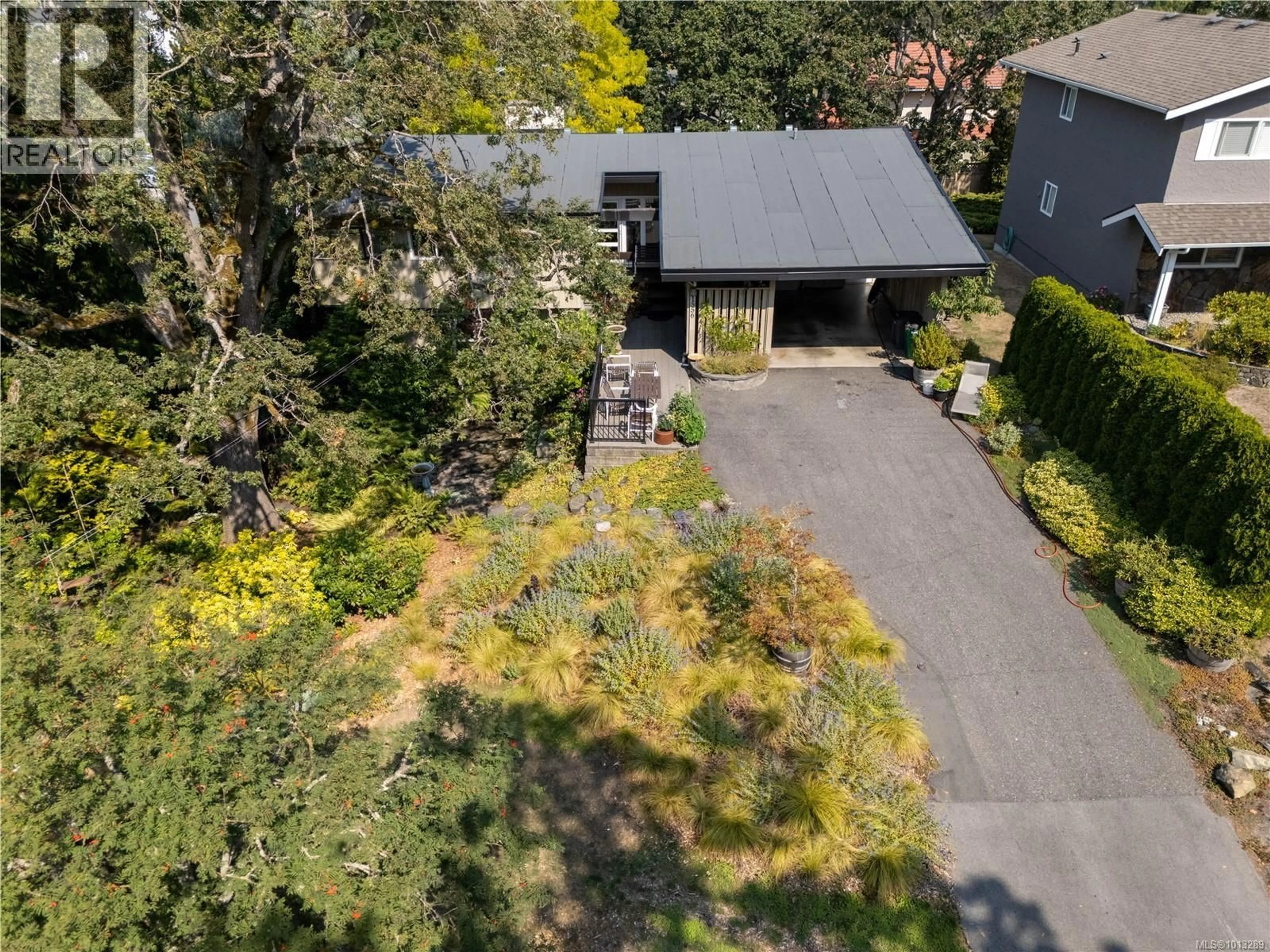 A pic from outside/outdoor area/front of a property/back of a property/a pic from drone, street for 1556 ARROW ROAD, Saanich British Columbia V8N1C5