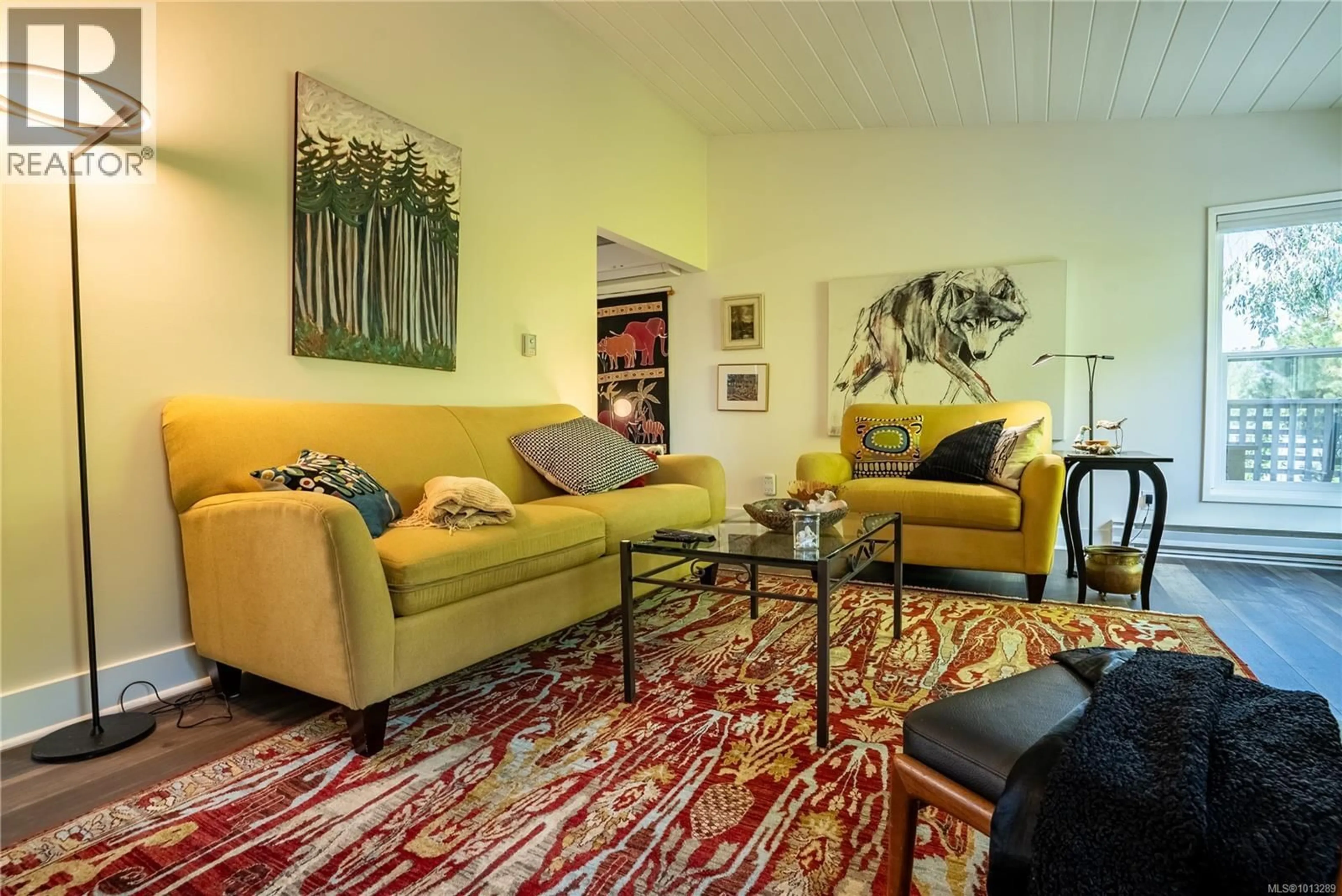 Living room with furniture, carpet floor for 1556 ARROW ROAD, Saanich British Columbia V8N1C5