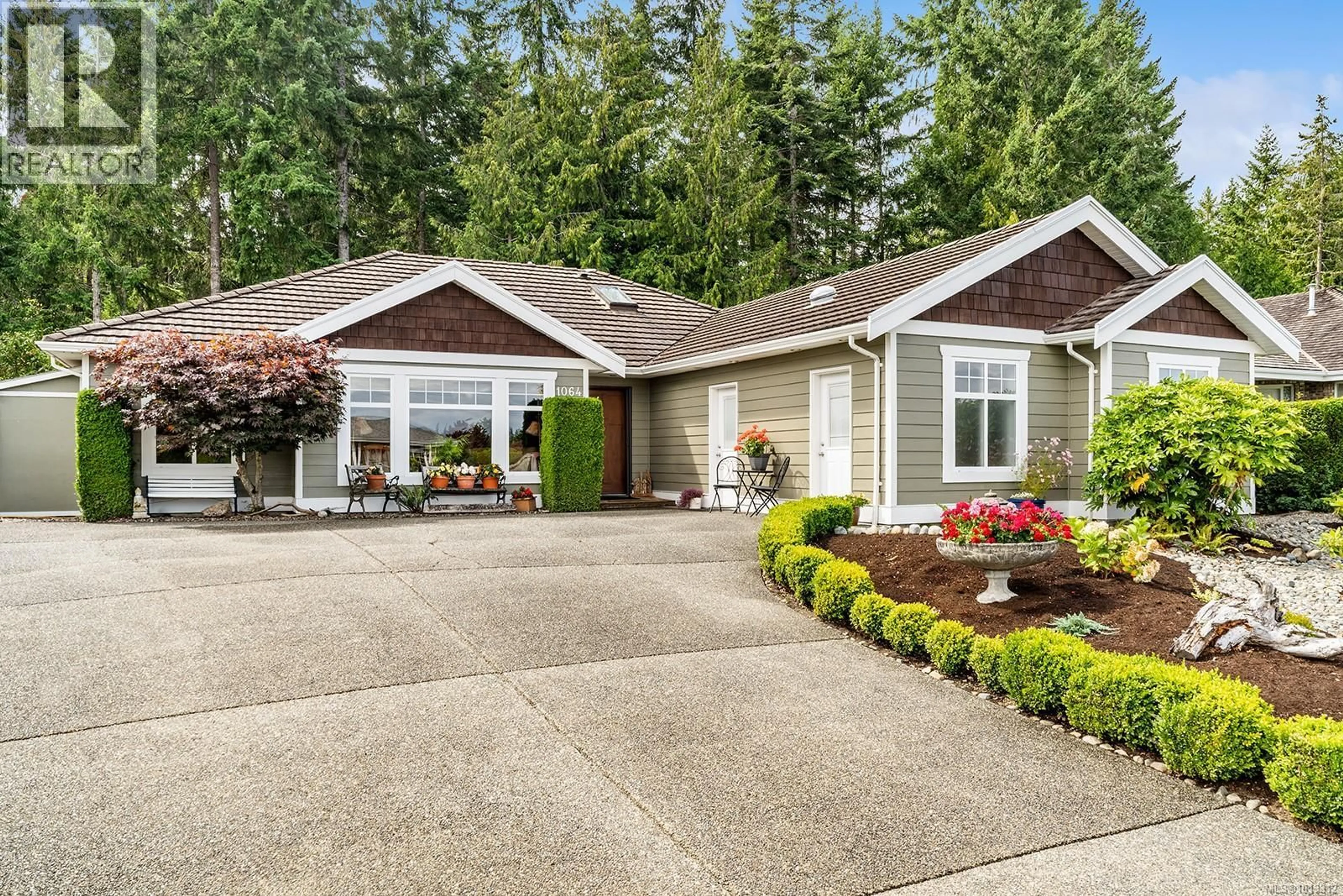 Home with vinyl exterior material, street for 1064 MIRALOMA DRIVE, Qualicum Beach British Columbia V9K2P1