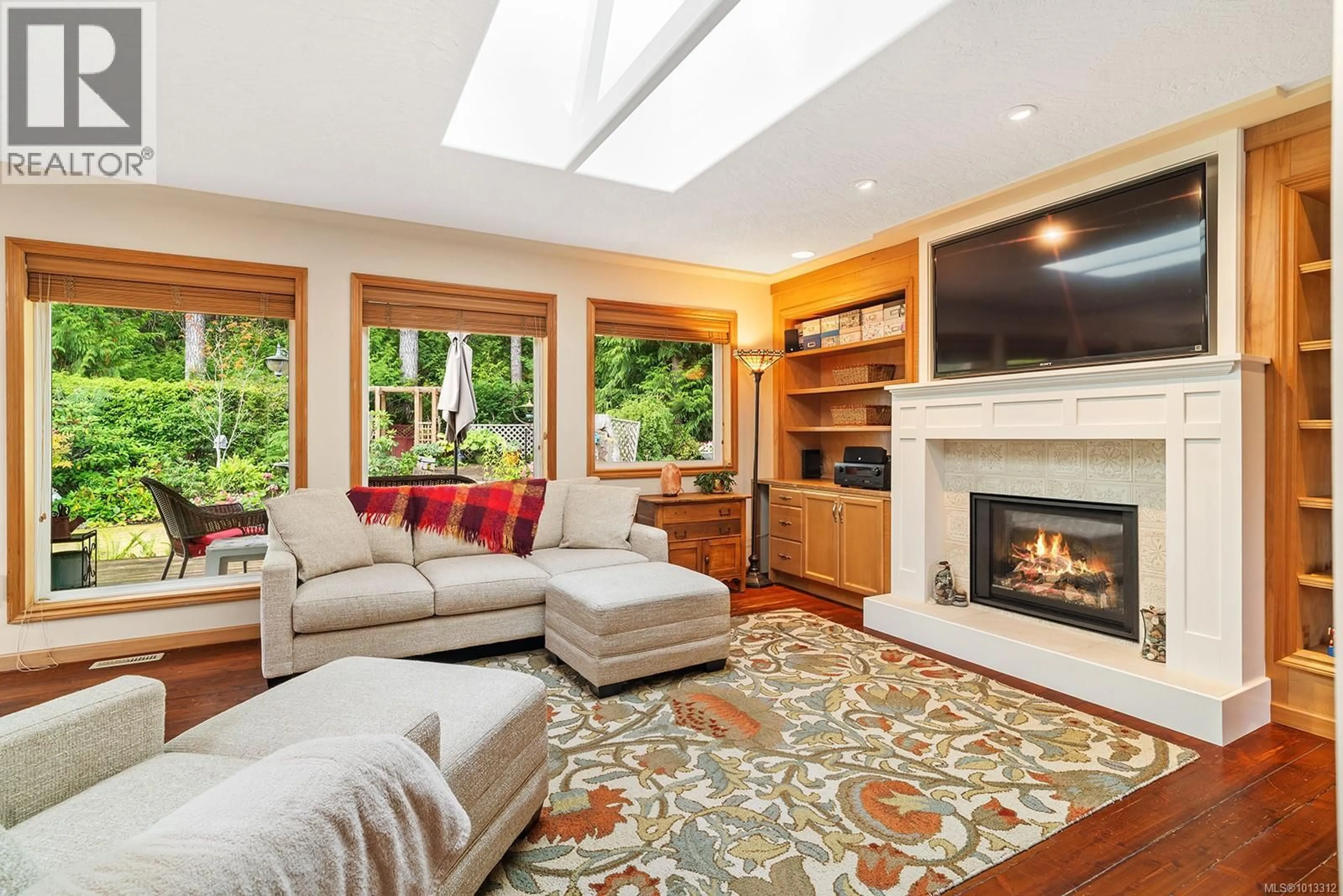 Living room with furniture, unknown for 1064 MIRALOMA DRIVE, Qualicum Beach British Columbia V9K2P1