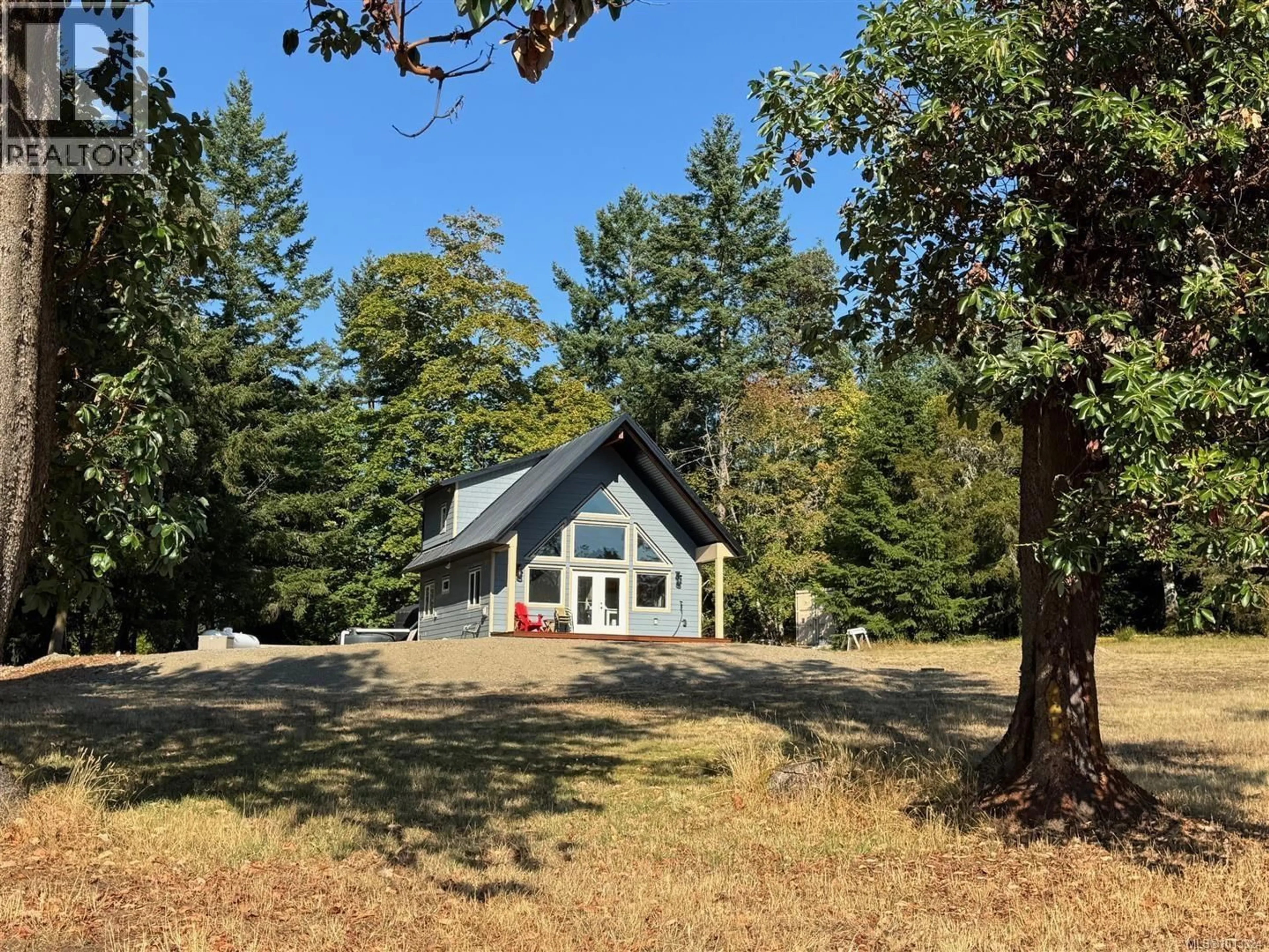 A pic from outside/outdoor area/front of a property/back of a property/a pic from drone, forest/trees view for SL94 - 313 EVERGREEN LANE, Sidney Island British Columbia V0N2G0