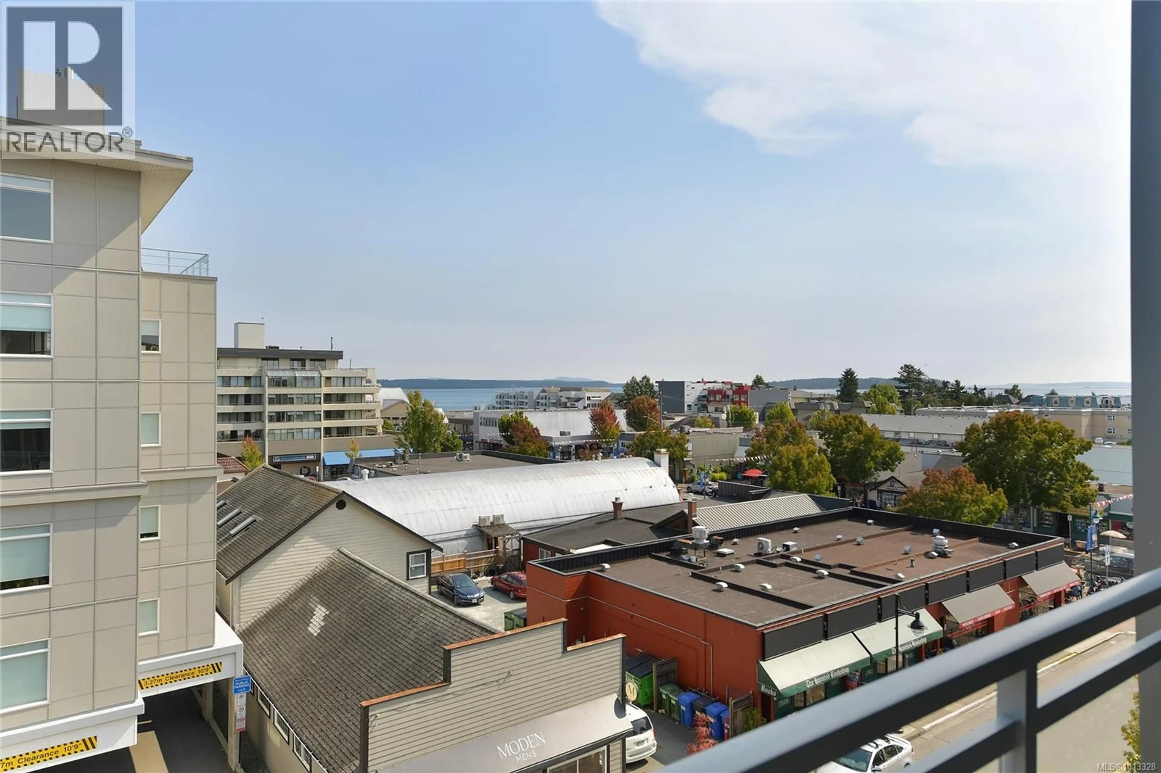 Balcony in the apartment, city buildings view from balcony for 505 - 9818 THIRD STREET, Sidney British Columbia V8L1Y2