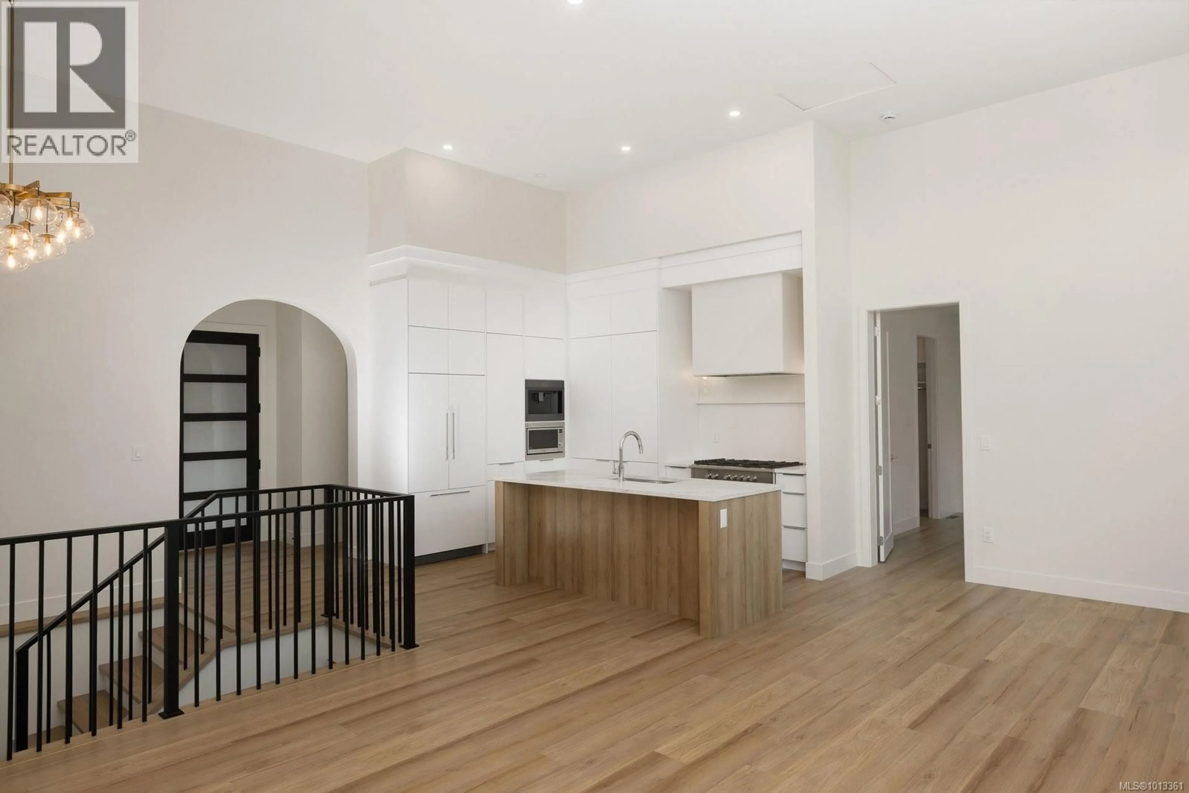 Open concept kitchen, wood/laminate floor for 105 - 2332 COPPER ROCK COURT, Langford British Columbia V9B0G4